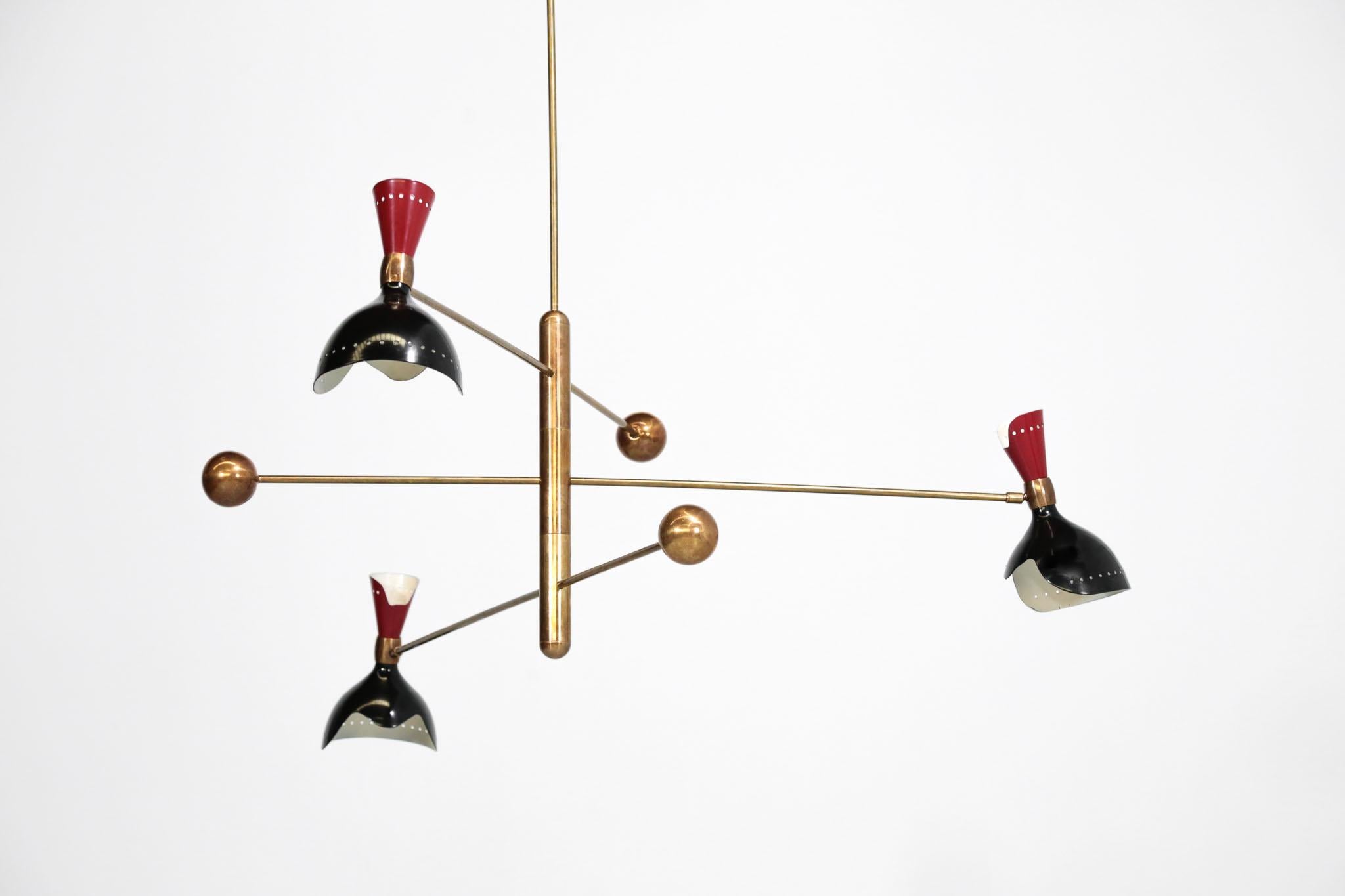Rare chandelier attributed to Stilnovo.
Composed of three adjustable arms with counter weight.
Made of brass and metal lampshades, black and red.
E14 and E24 bulbs.
Excellent condition.