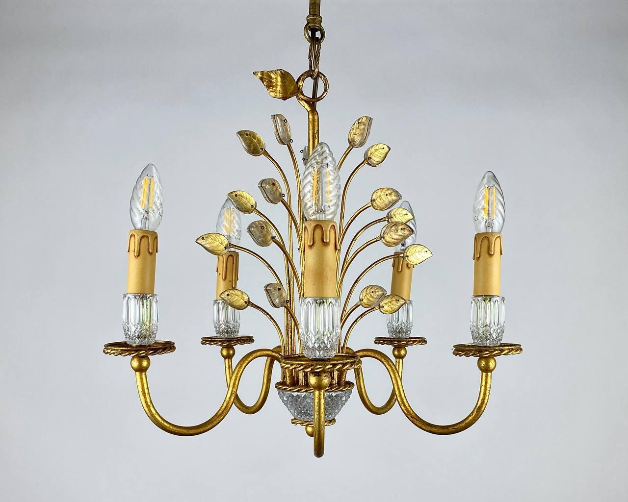 Italian glass leaf and metal chandelier by Banci Florence, Italy, 1970’s.

 Amazing hand crafted chandelier using Murano glass leaves set into a gilt metal frame, to the bottom is crystal base, bearing five lamp holders, all sit upon an individual