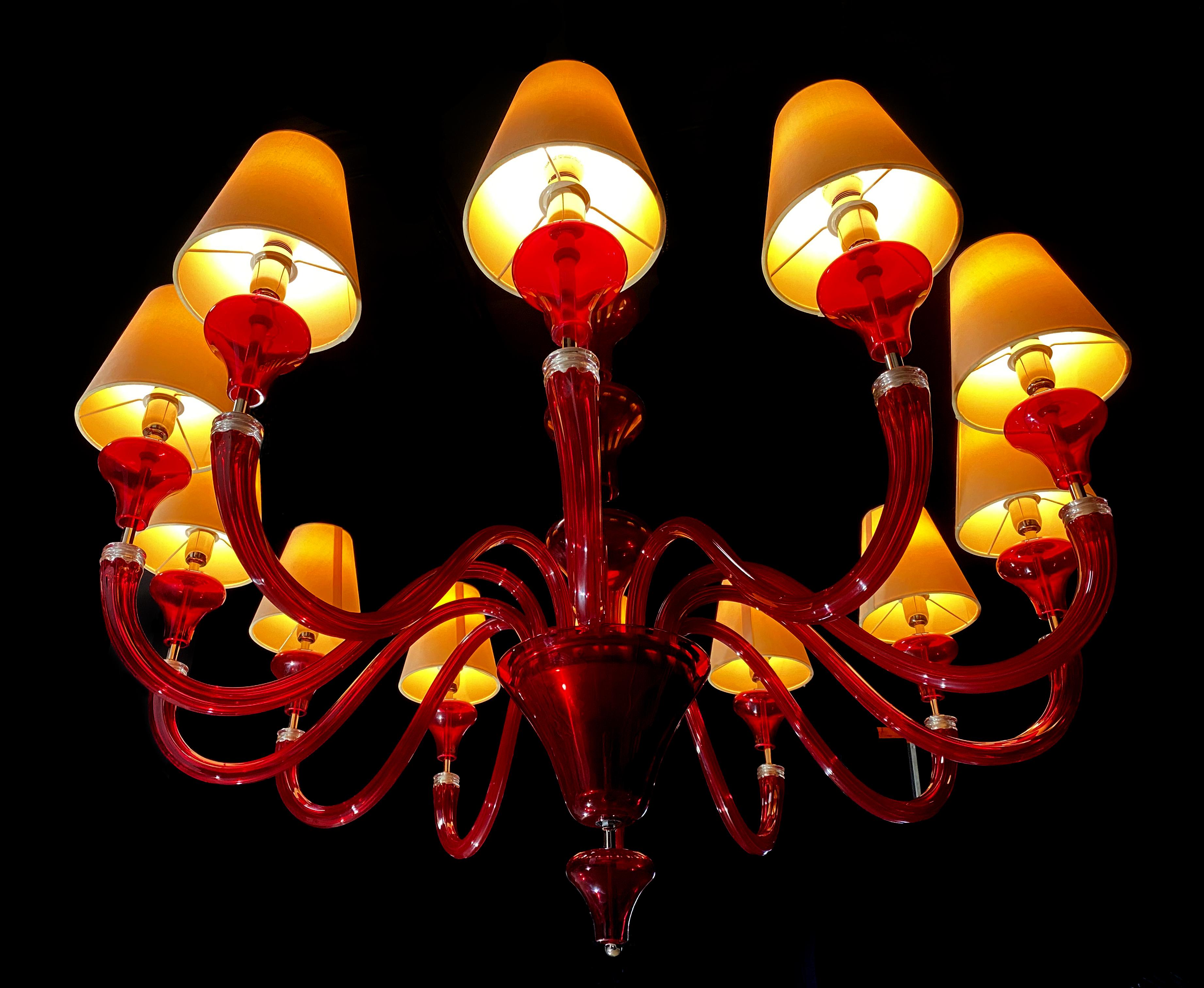 Flamboyant chandelier from the famous Barovier & Toso furnace. 12 ruby red arms to make the protagonist of a representative hall. A six-armed pair is also available.
