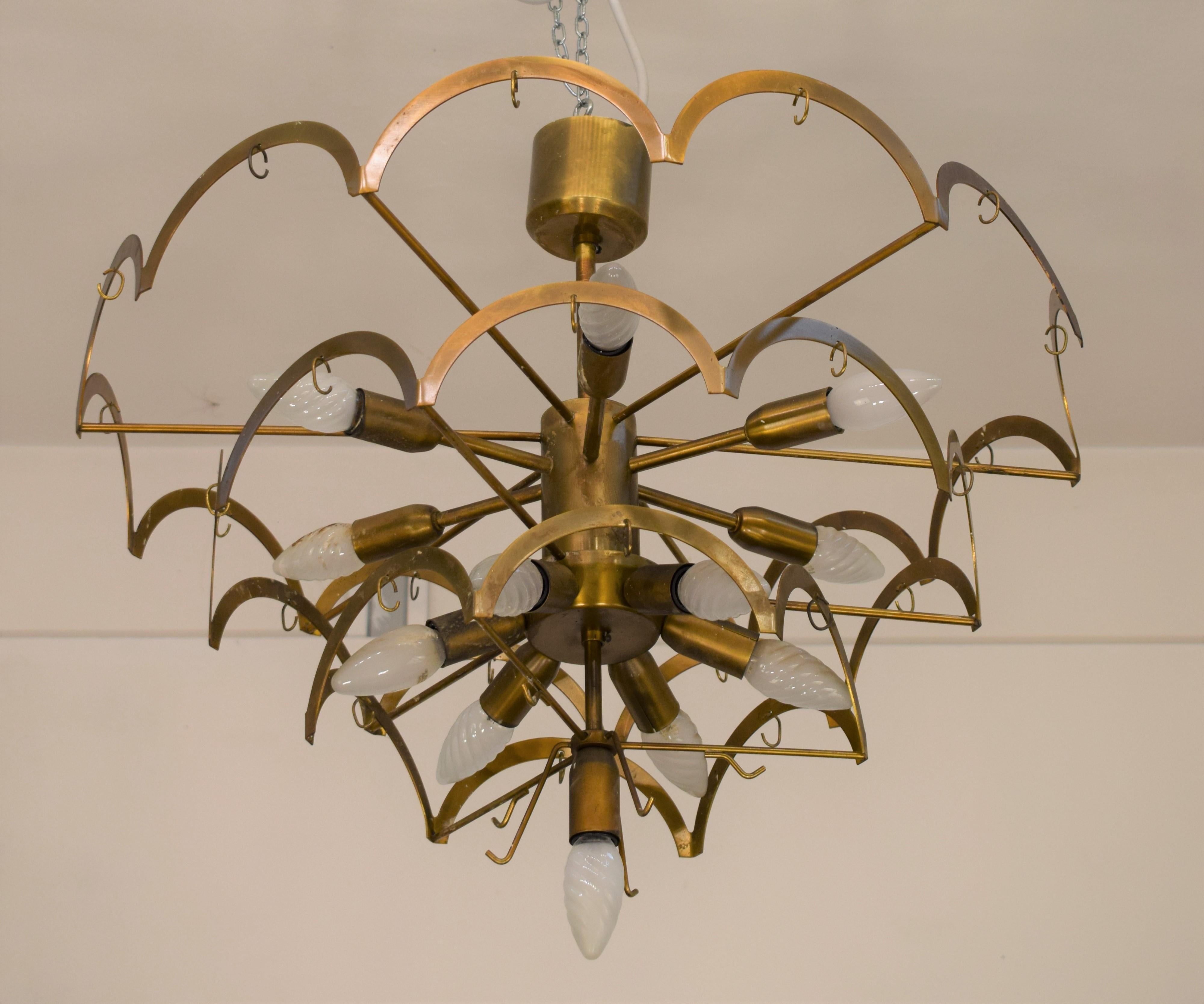 Italian chandelier by Vistosi, 1960s.

Dimensions: H= 65 cm; D= 65 cm.