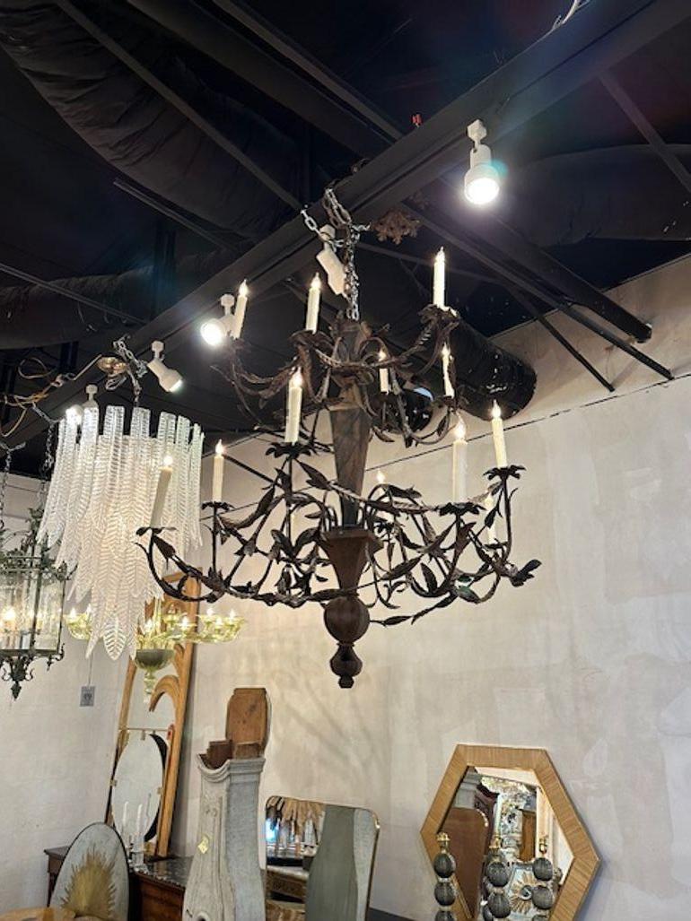Late 19th century Italian wood and iron 14-light chandelier from Rome. Circa 1890. The chandelier has been professionally rewired, comes with matching chain and canopy. It is ready to hang!
