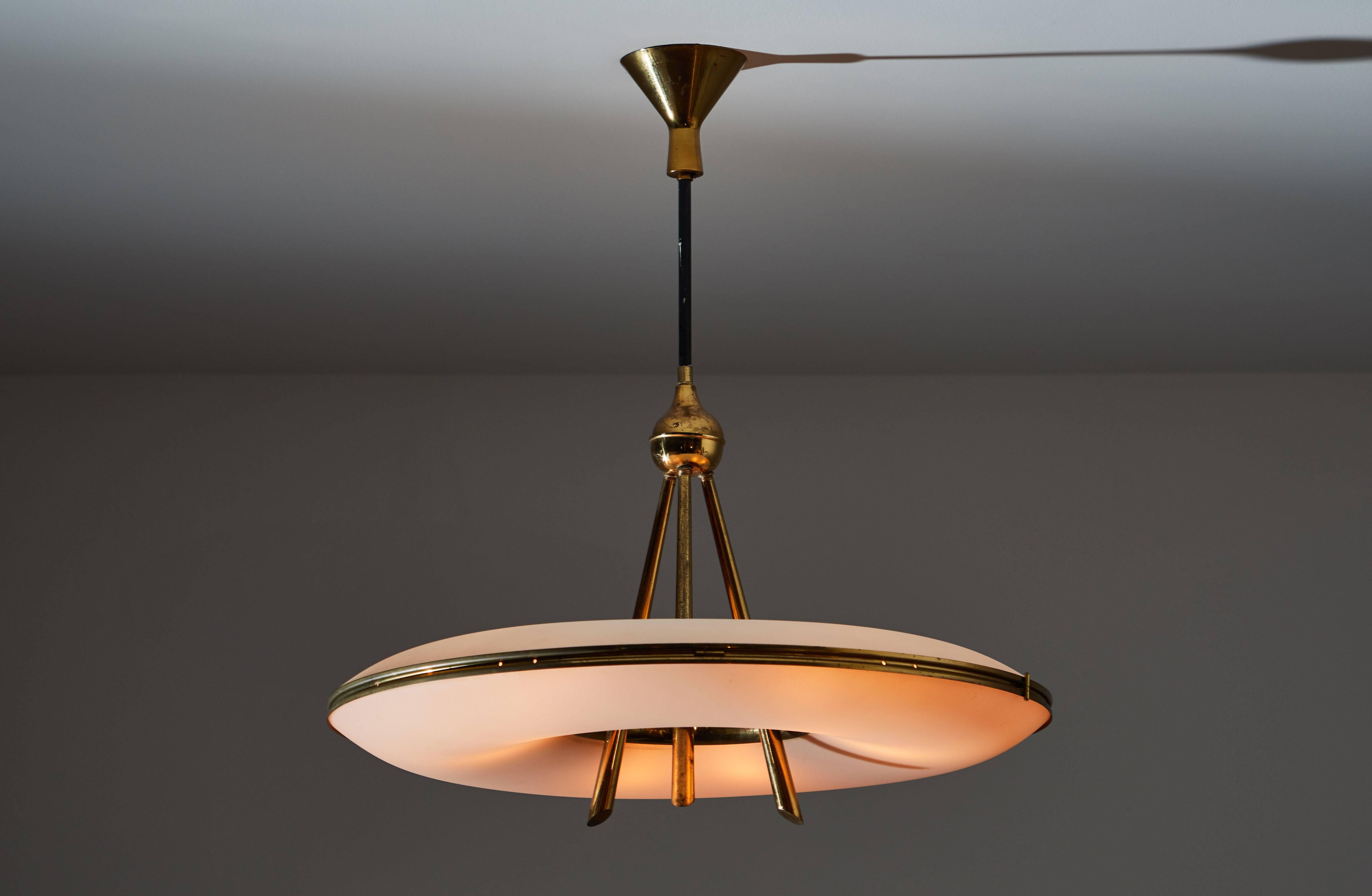 Chandelier manufactured in Italy, circa 1950s. Brass and brushed satin glass diffuser. Rewired for US junction boxes. Original canopy. Takes three E14 European candelabra 60w maximum per bulb.