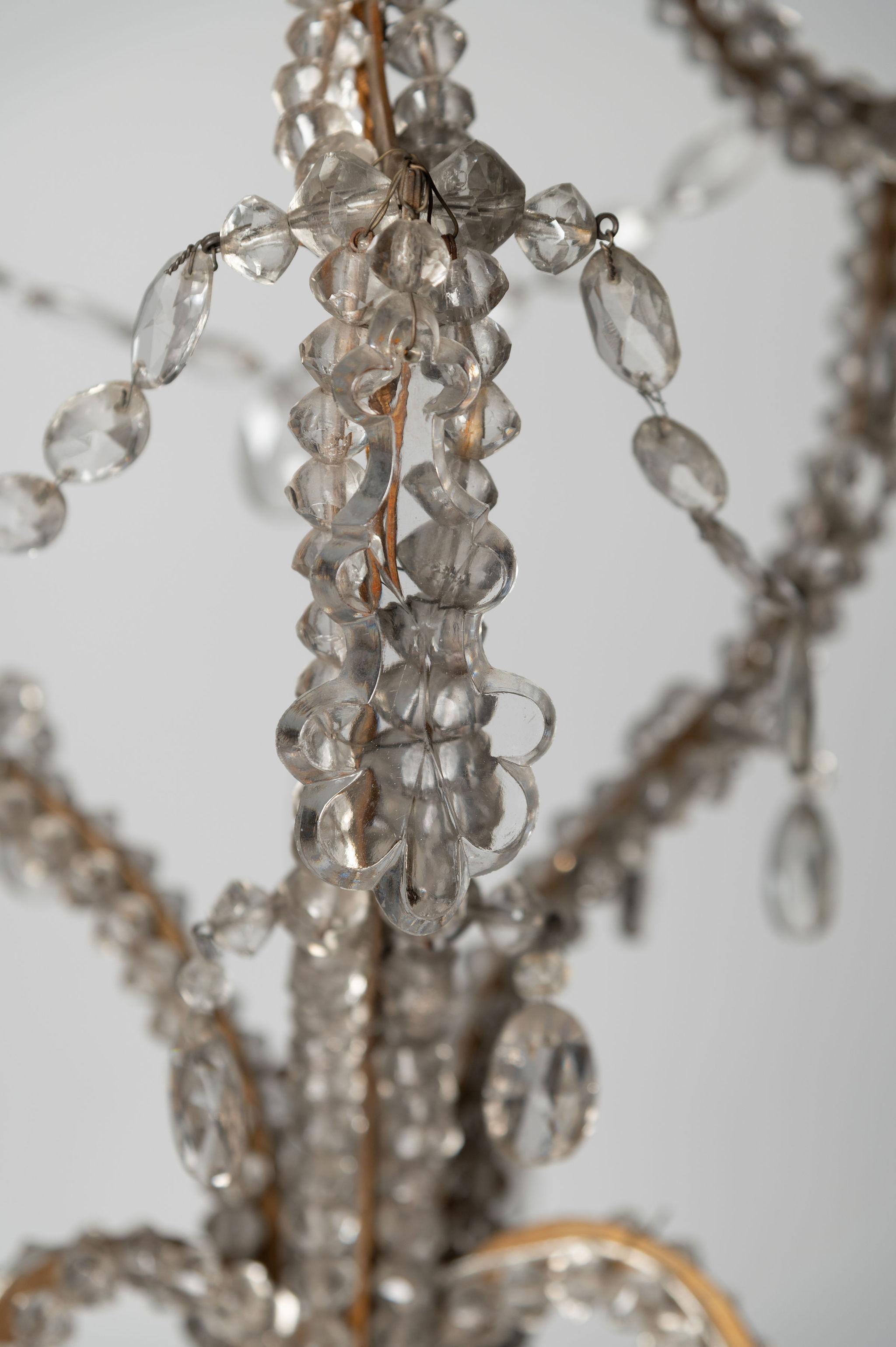 Unusual shape pretty Italian chandelier, three arms, wired and working in the U.K. The below height does not include any chain, there is currently around 12 inches of chain that can be cut as required. No ceiling rose. 

Width: 18 