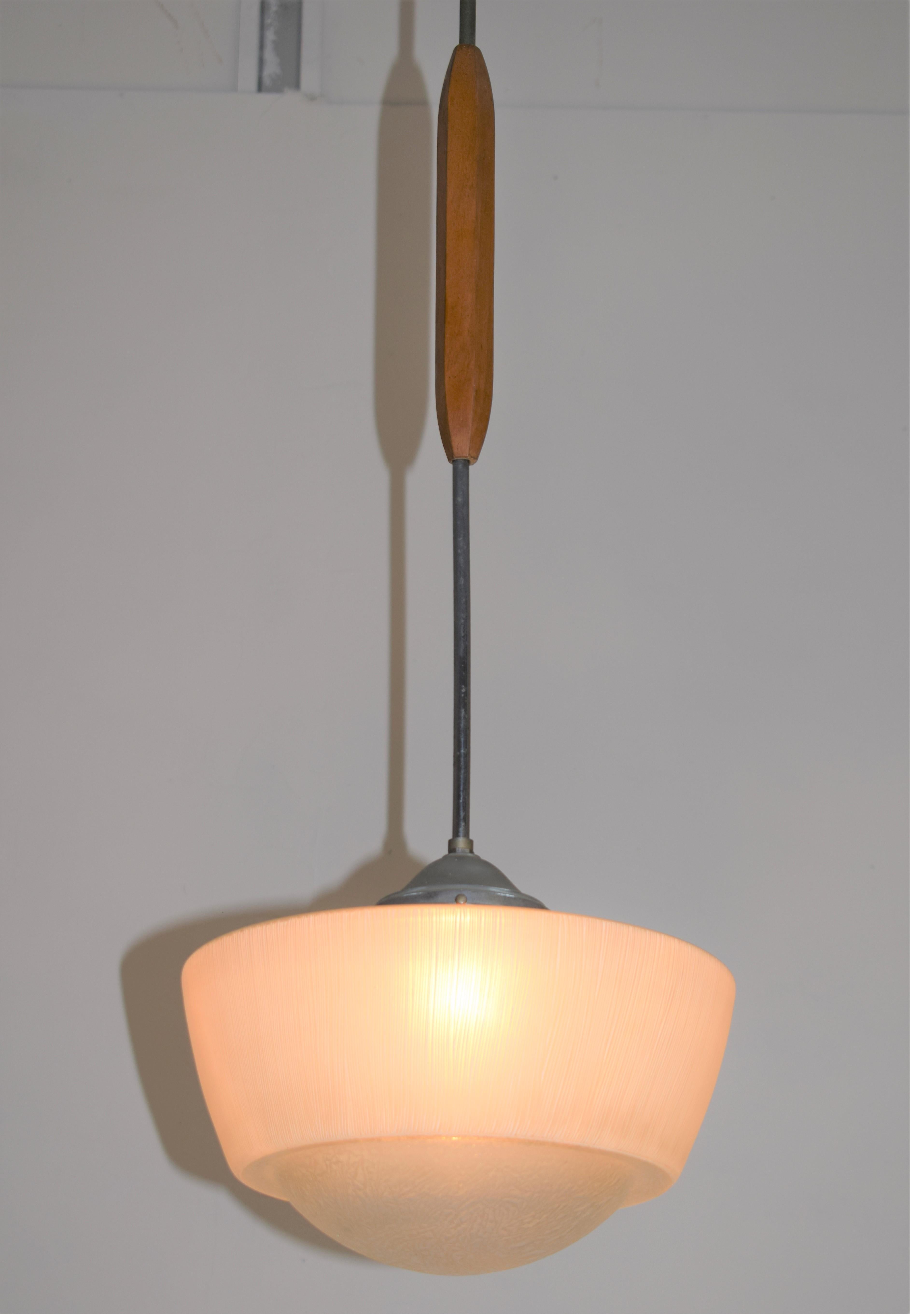 Italian chandelier, glass, metal and wood, 1960s.

Dimensions: H= 110 cm; D= 30 cm.