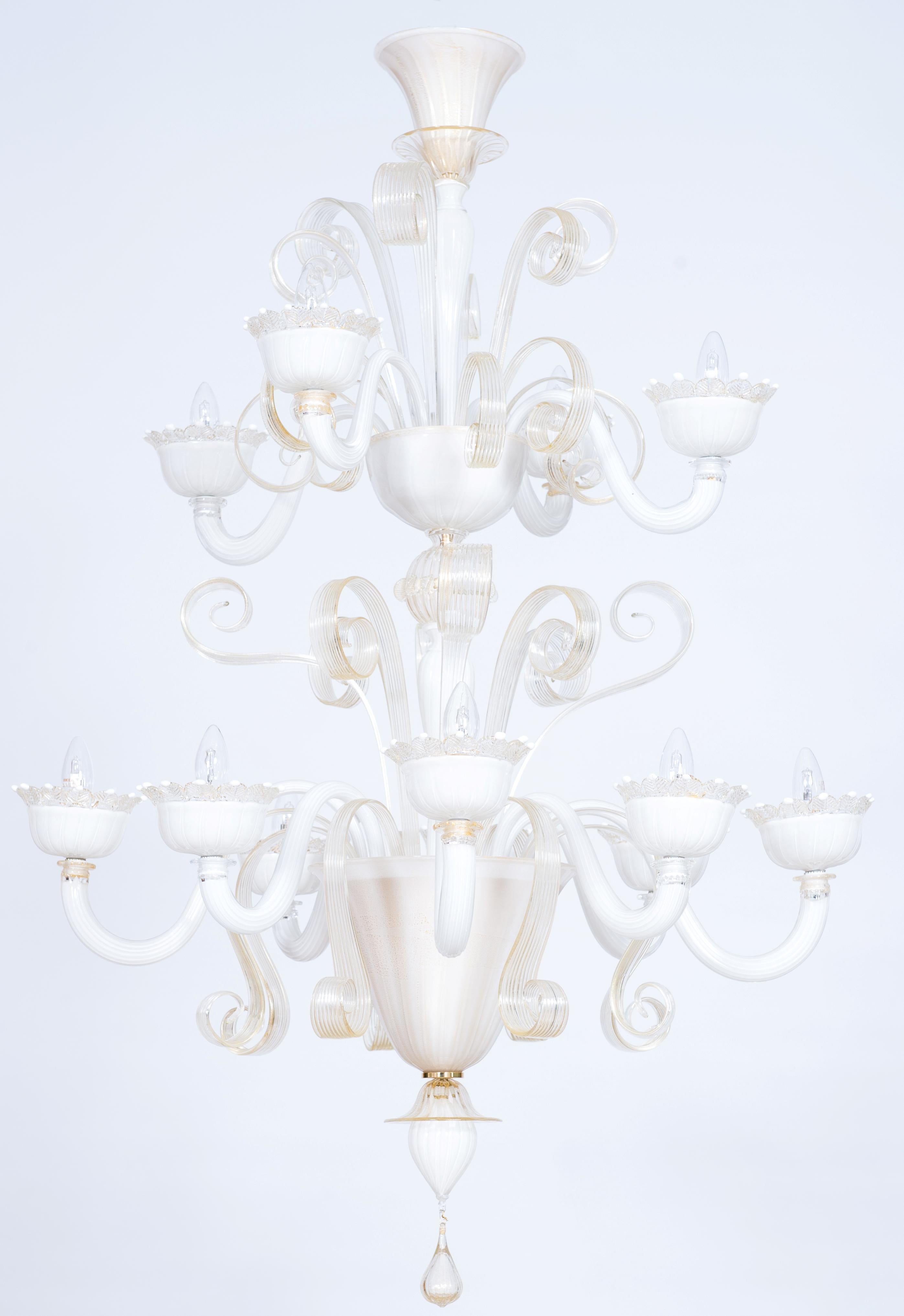 A Majestic White-Milk Murano Glass Chandelier with Gold Accents, Designed by Giovanni Dalla Fina, 21st Century Italy.
This breathtaking chandelier, entirely handcrafted from blown Murano glass, embodies the artistry and elegance of contemporary
