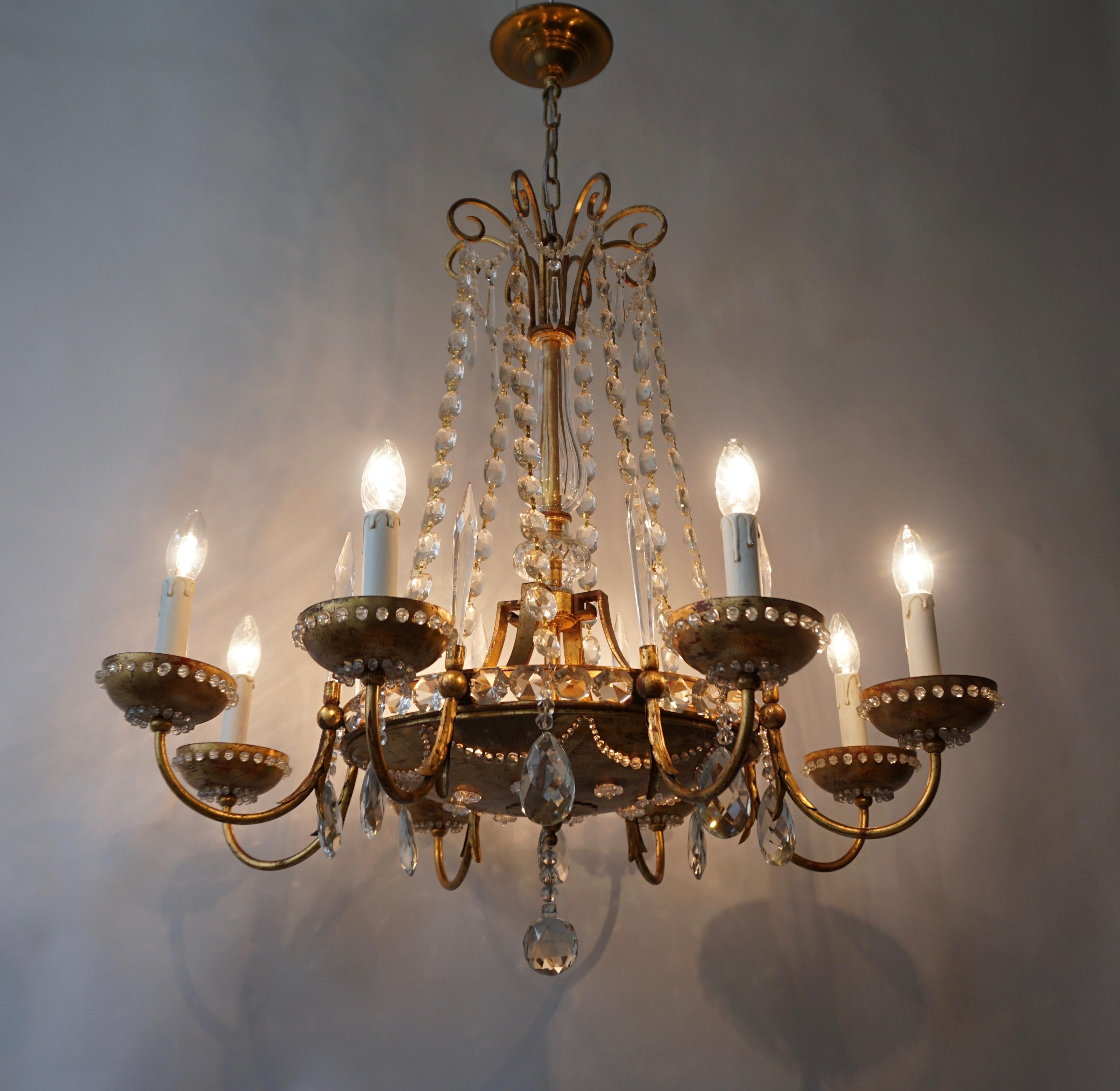 Large elegant Italian chandelier in brass and crystal.
Diameter 84 cm.
Height fixture 80 cm.
Total height 110 cm.
Four E27 bulbs.
Eight E14 bulbs.