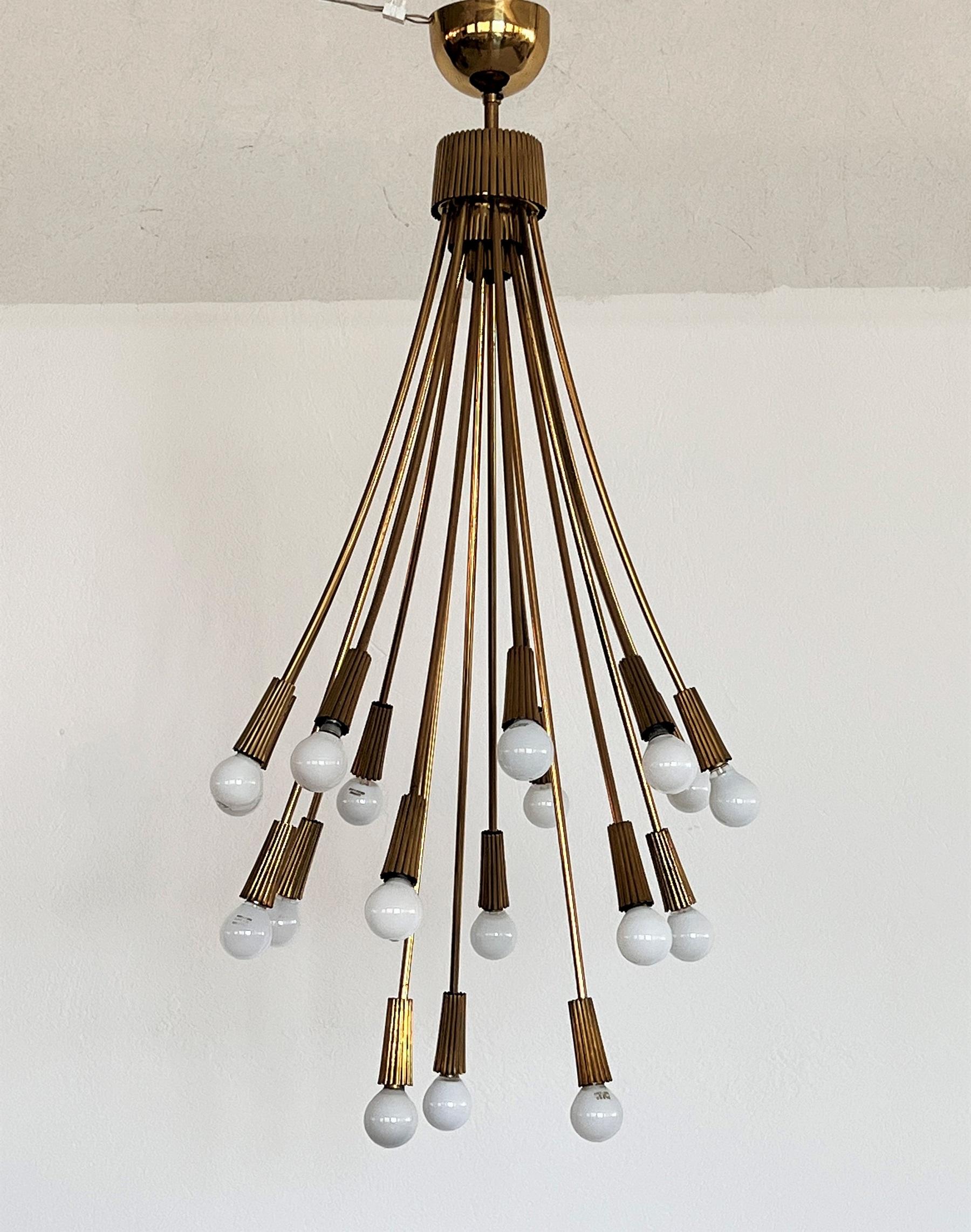Rare, beautiful and unusual brass chandelier.
Made in Italy in the 60s - 70s.
The chandelier has a total of 18 arms for 18 small candelabra bulbs.
There is a double switch so you can either turn on only 9 bulbs, or all 18 bulbs.
The chandelier is in