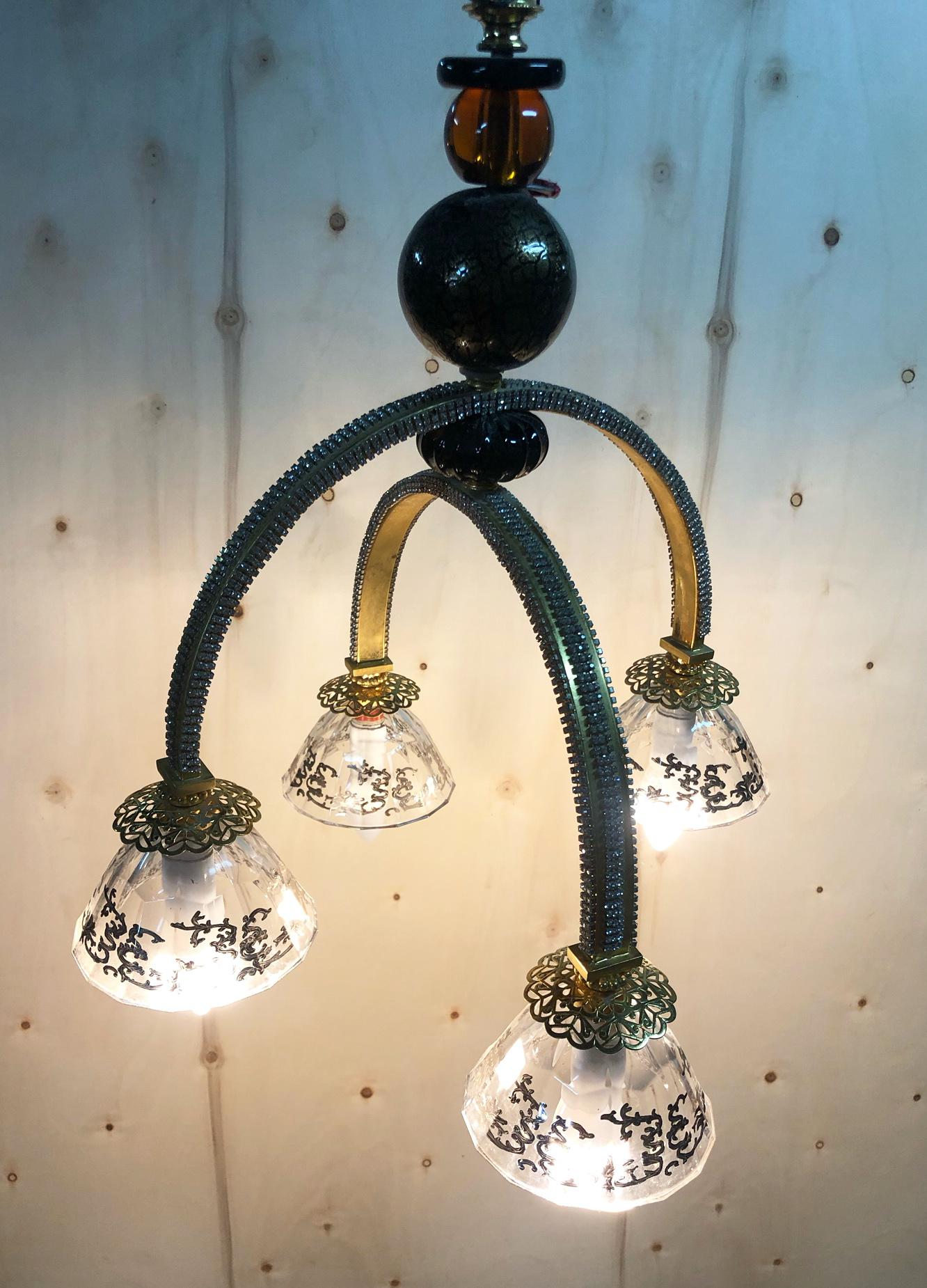 Italian chandelier in rhinestones with four lights with original gold coloring. 
The four lights have an E14 type connection and run on 220V.
The coloring is very beautiful and elegant.
If the voltage of your country is 110 Volt or other, consult