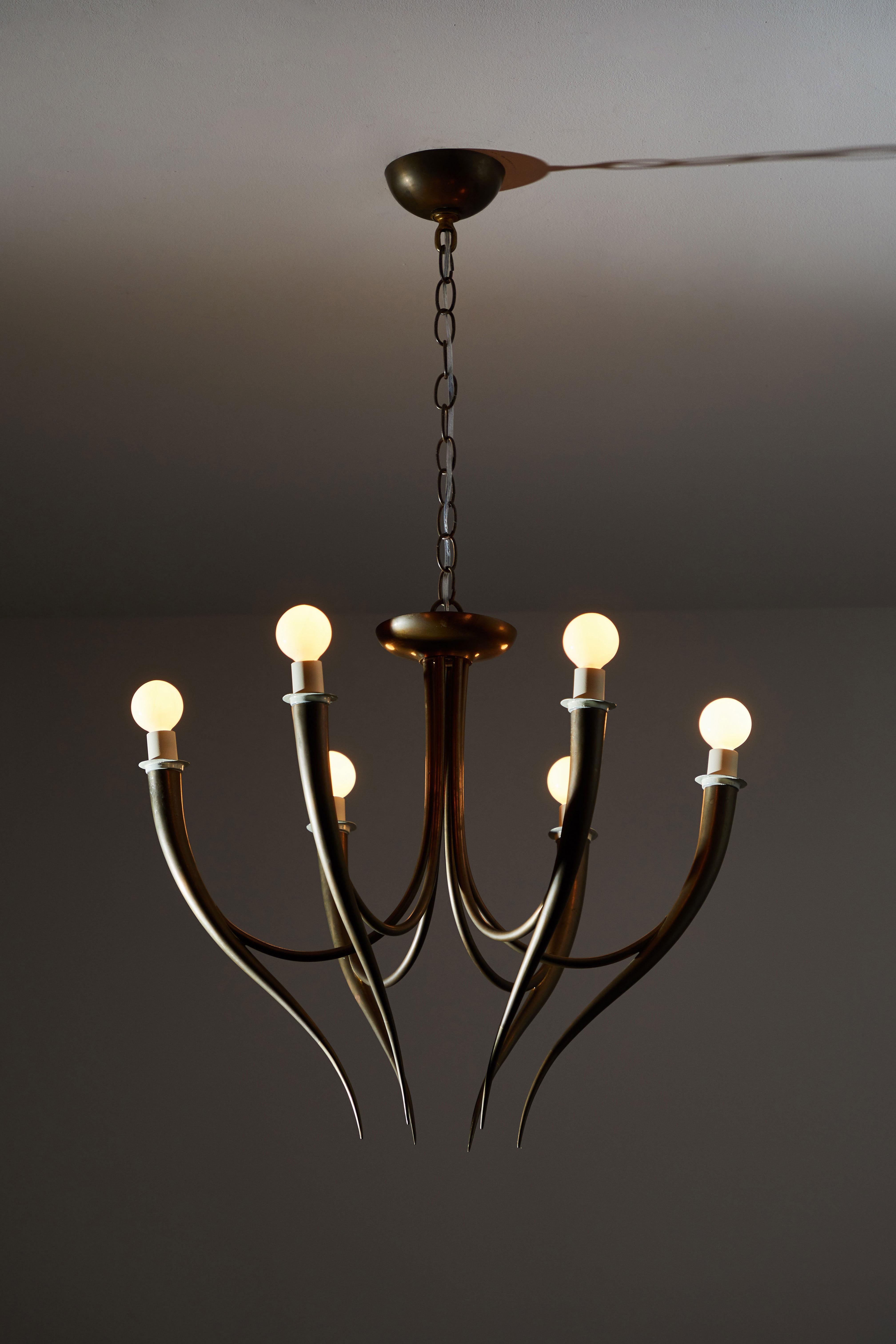 Italian chandelier in the style of Gio Ponti. Manufactured in Italy, circa 1950s. Original patinated brass, original canopy. Rewired for US junction boxes. Takes six E14 European candelabra bulbs.