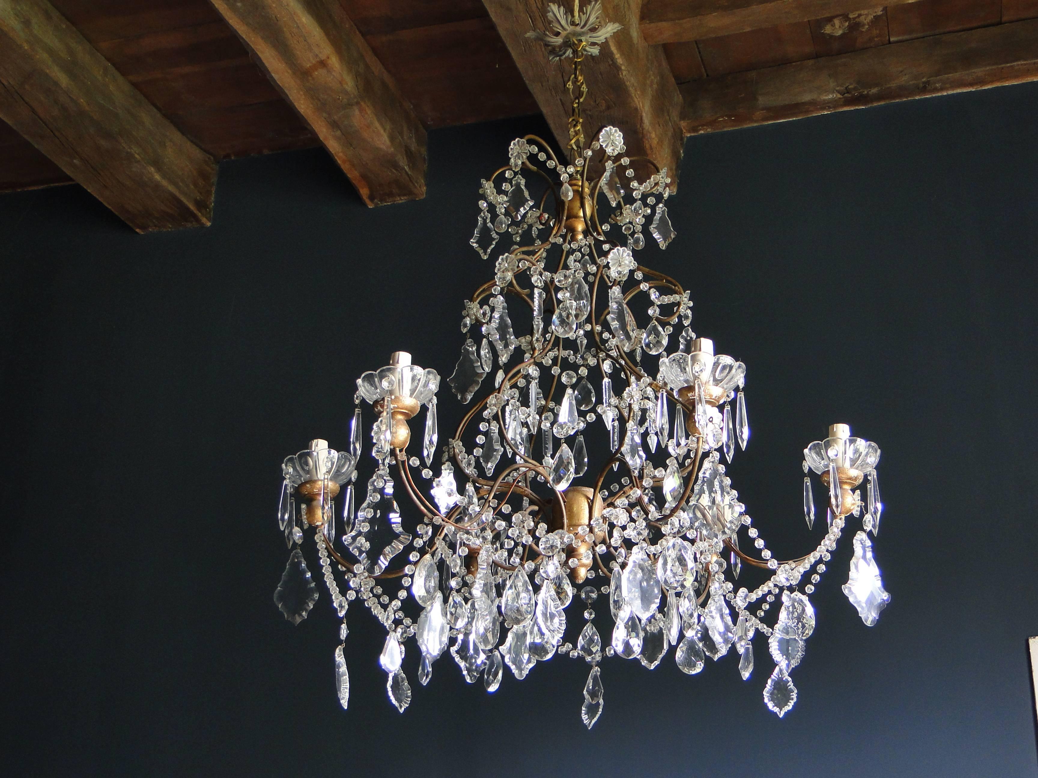 Beautiful Italian chandelier iron and wood with crystal and glass beads and pendants.
