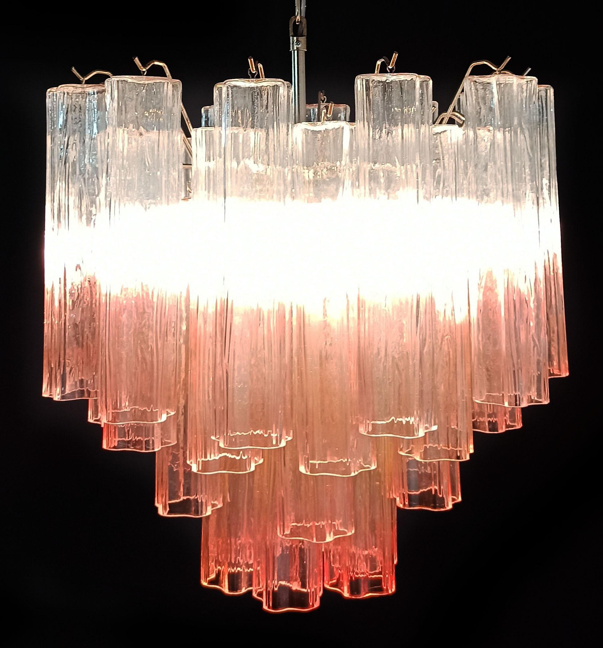 Italian vintage chandelier in Murano glass and nickel-plated metal structure. The armor polished nickel supports 36 large shaded pink glass tubes in a star shape.
Period:late XX century
Dimensions: 50,40 inches (128 cm) height with chain; 21,30