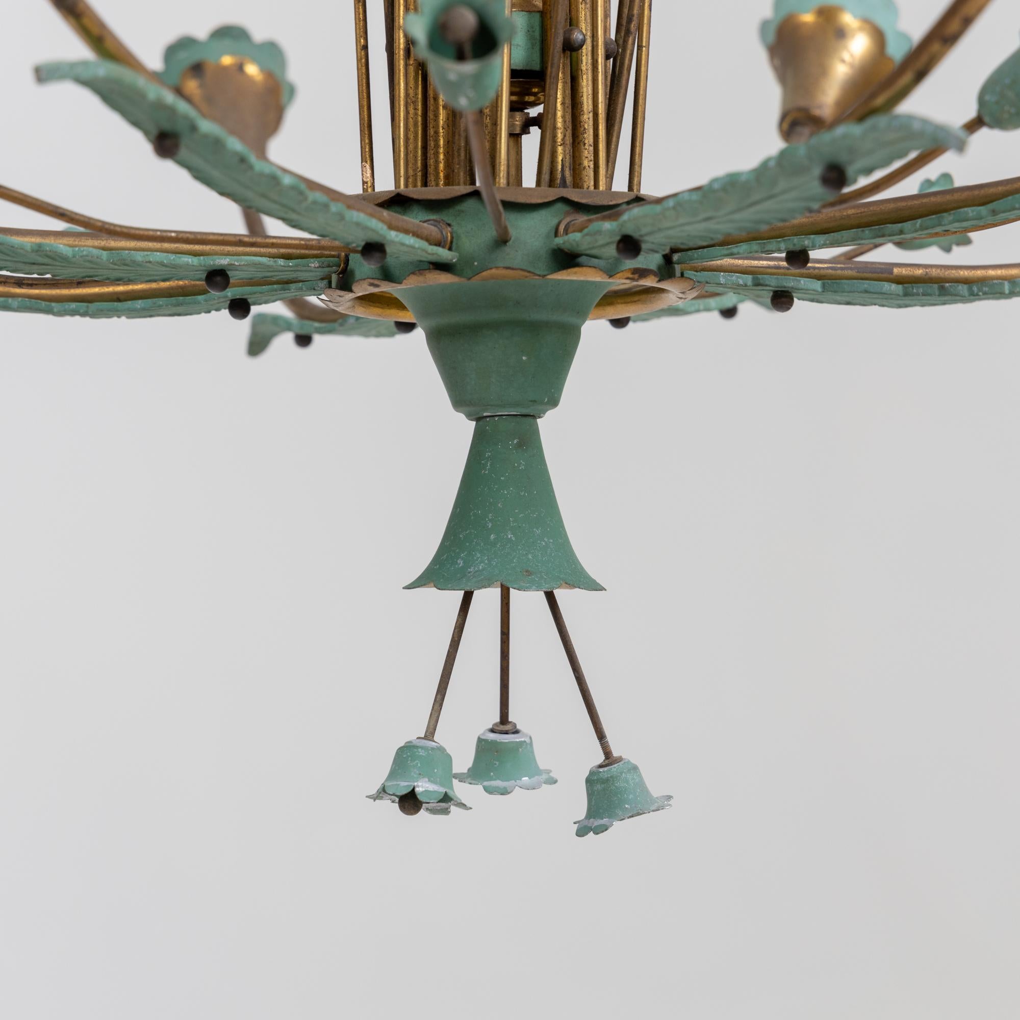 Large brass chandelier with turquoise flower and leaf decoration and 16 burners.