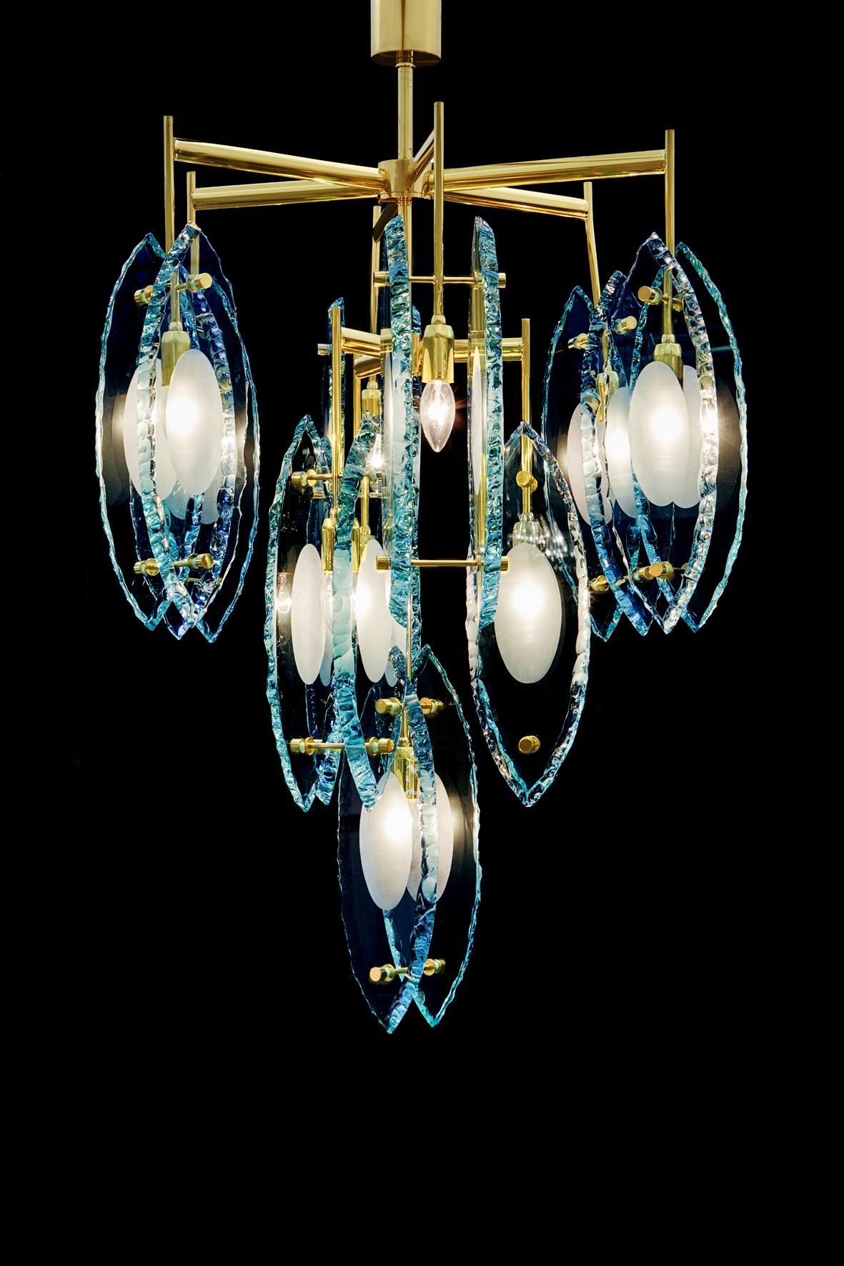 Italian chandelier with thick etched glasses, mounted on polished brass frame, exclusive design by Gianluca Fontana, made in Italy, 21st century.