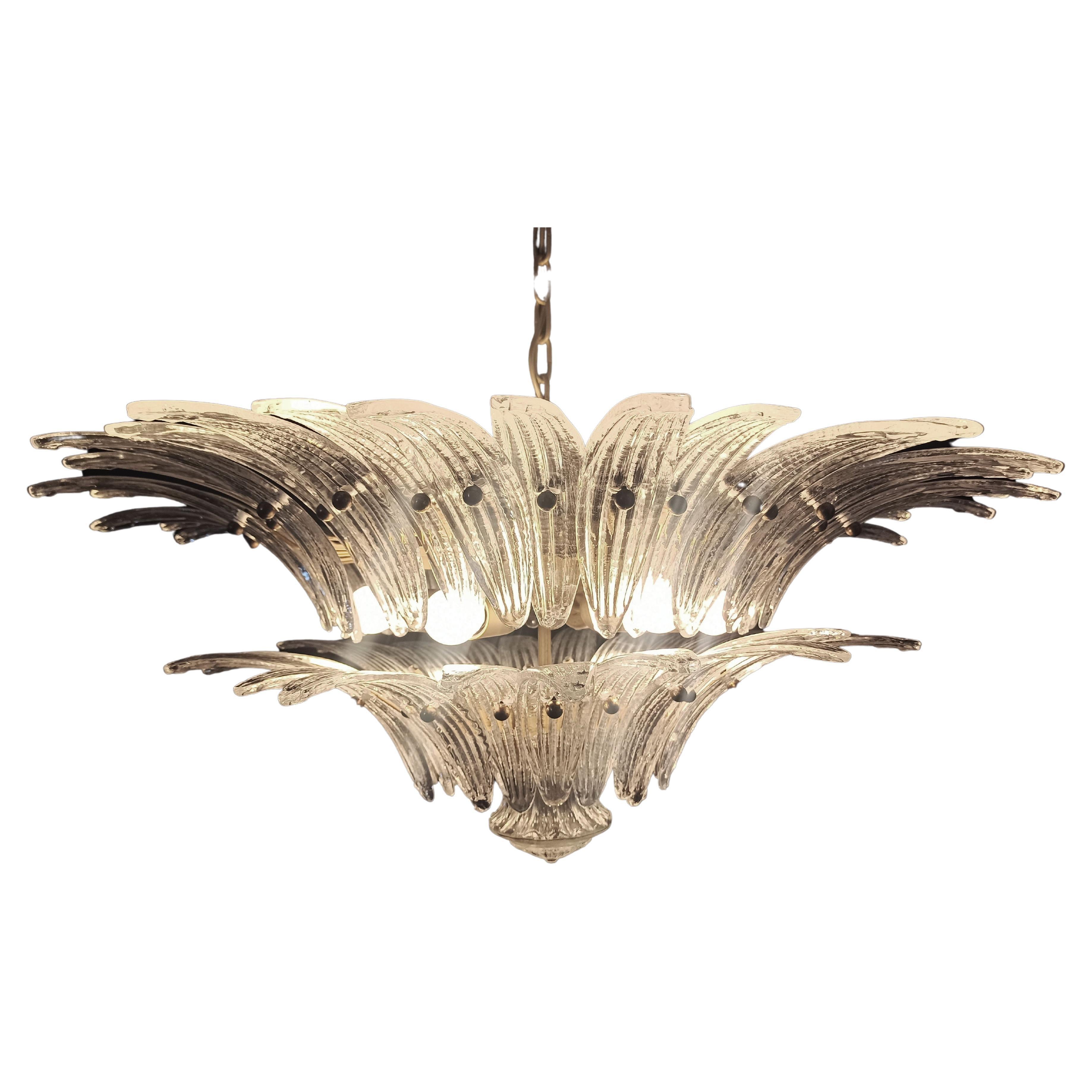 Murano glass chandelier, handmade in Murano. Each is made by 58 Murano crystal glasses in a gold metal frame. The chandelier has also a Murano glass ball in the end of the lamp. Murano blown glass in a traditional way.
Period: