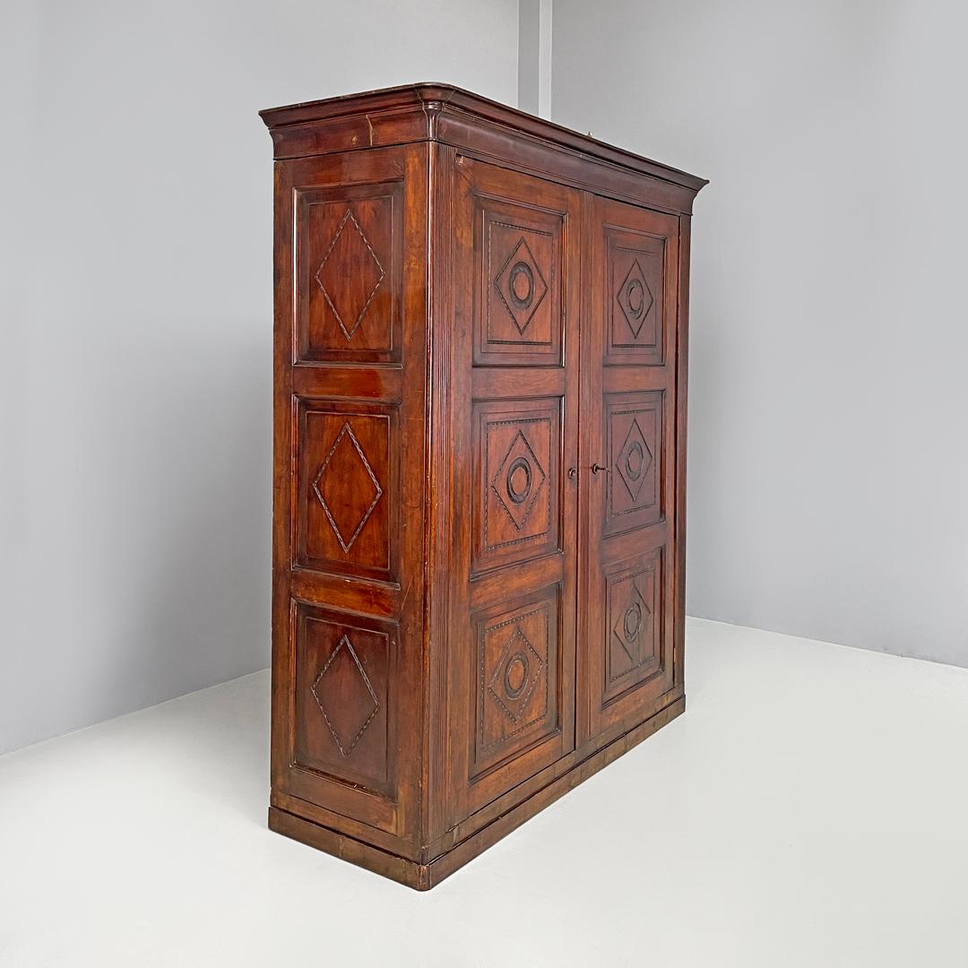 Early 19th Century Italian Charles X style two-door wooden wardrobe with decorations, early 1800s For Sale
