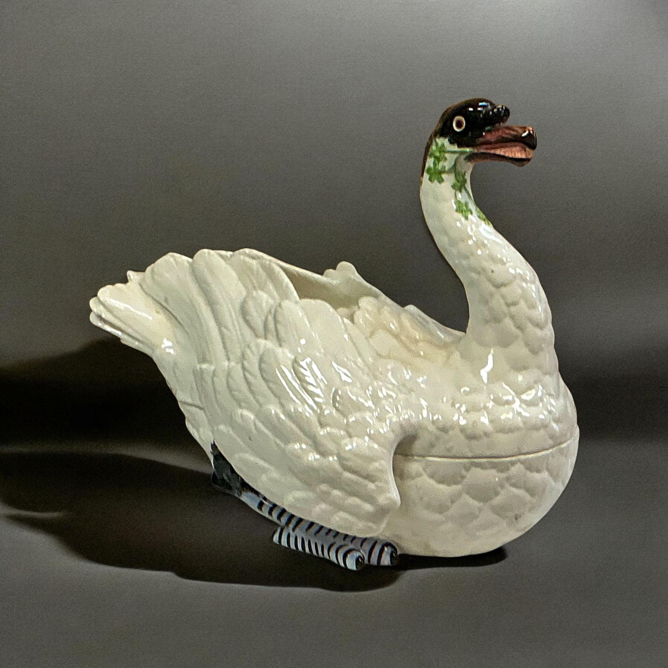 This is a hand painted Italian swan form serving tureen by Chelsea House. It is done in the style of early Meissen pieces. It is hand painted and in very good condition. It does bear the maker’s mark on the underside of the bird. Perfect for the