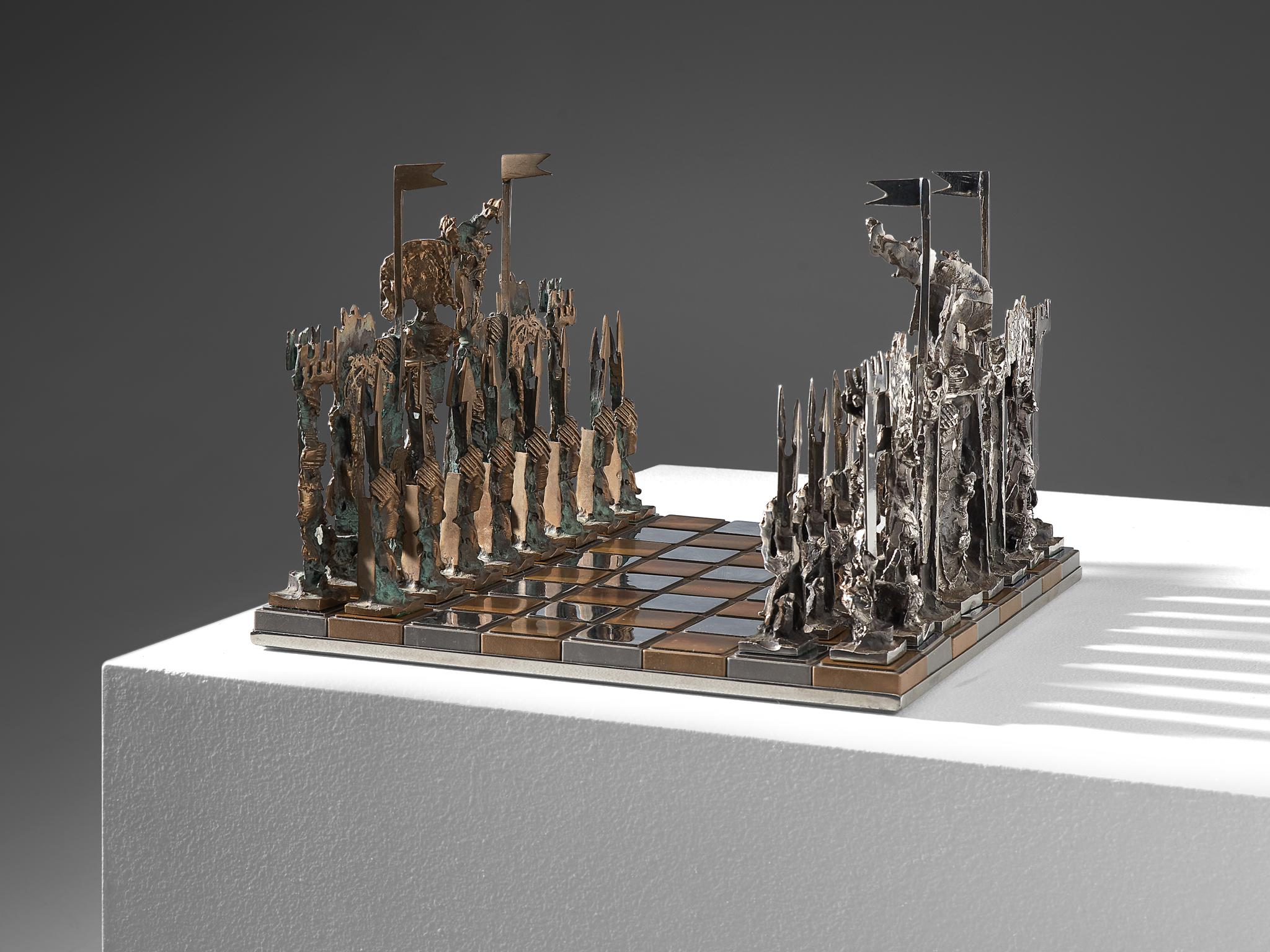 Chess game, bronze, bronze, metal and mirror, Italy, circa 1970.  

Exceptional game of chess. The board consists of silver colored metal and bronze mirrored cubes. All chess pieces are casted, solid and therefore are very heavy. It's noticeable