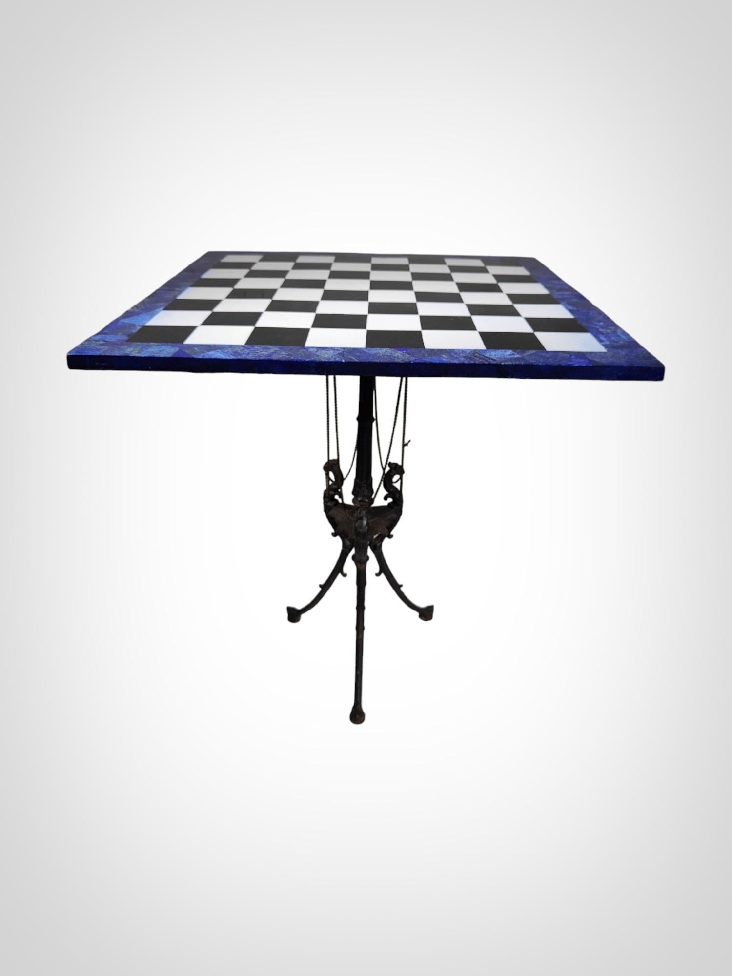 This elegant Italian chess table from the 1950s is an exceptional piece crafted in lapis lazuli and various types of marble. The meticulous craftsmanship and the use of high-quality materials make this table a testament to the elegance and