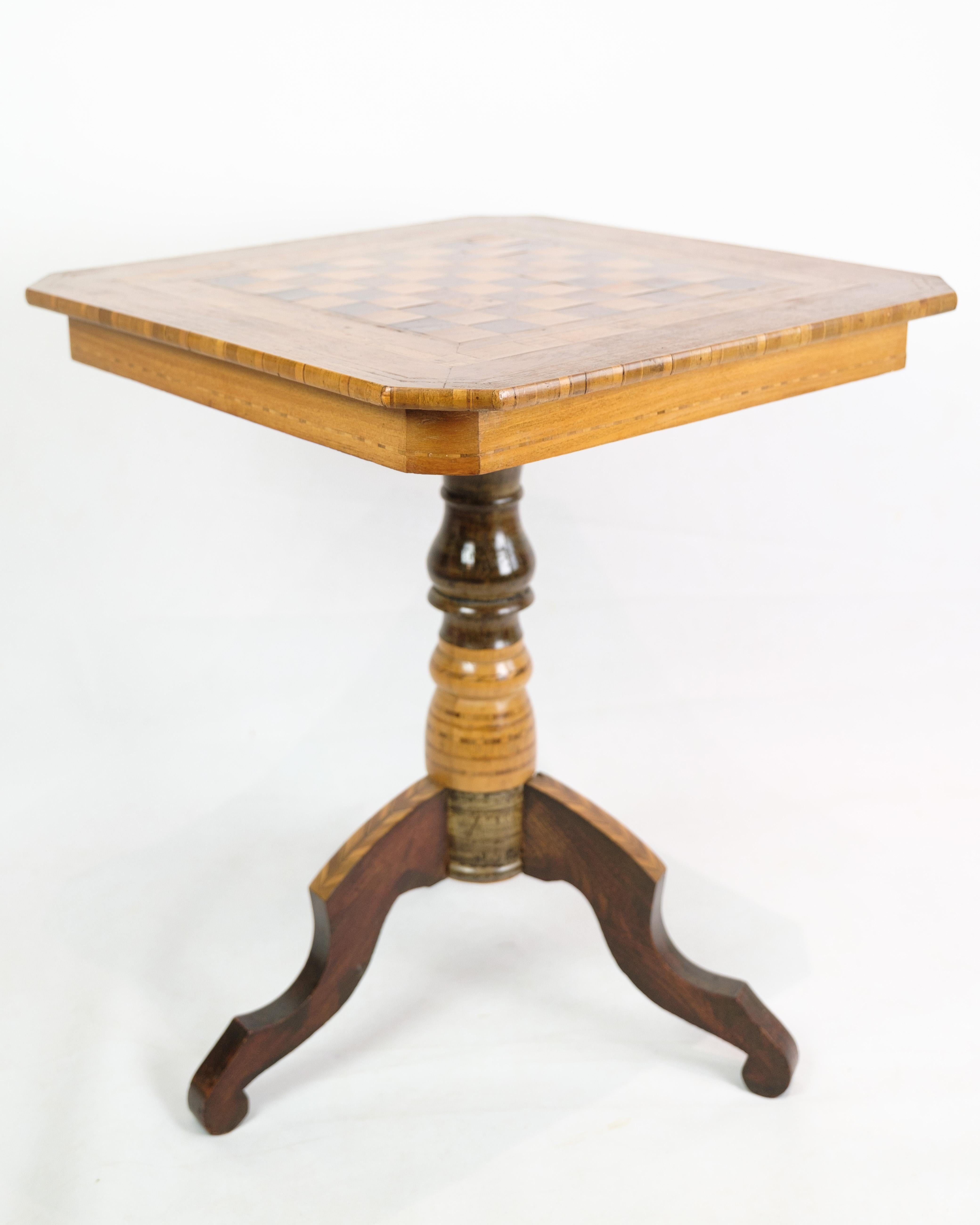 The Italian chess table, created around the 1860s, is a magnificent representation of traditional craftsmanship and artistic skill. It is richly decorated with various intarsia of fruit wood carefully inlaid to create beautiful patterns and designs