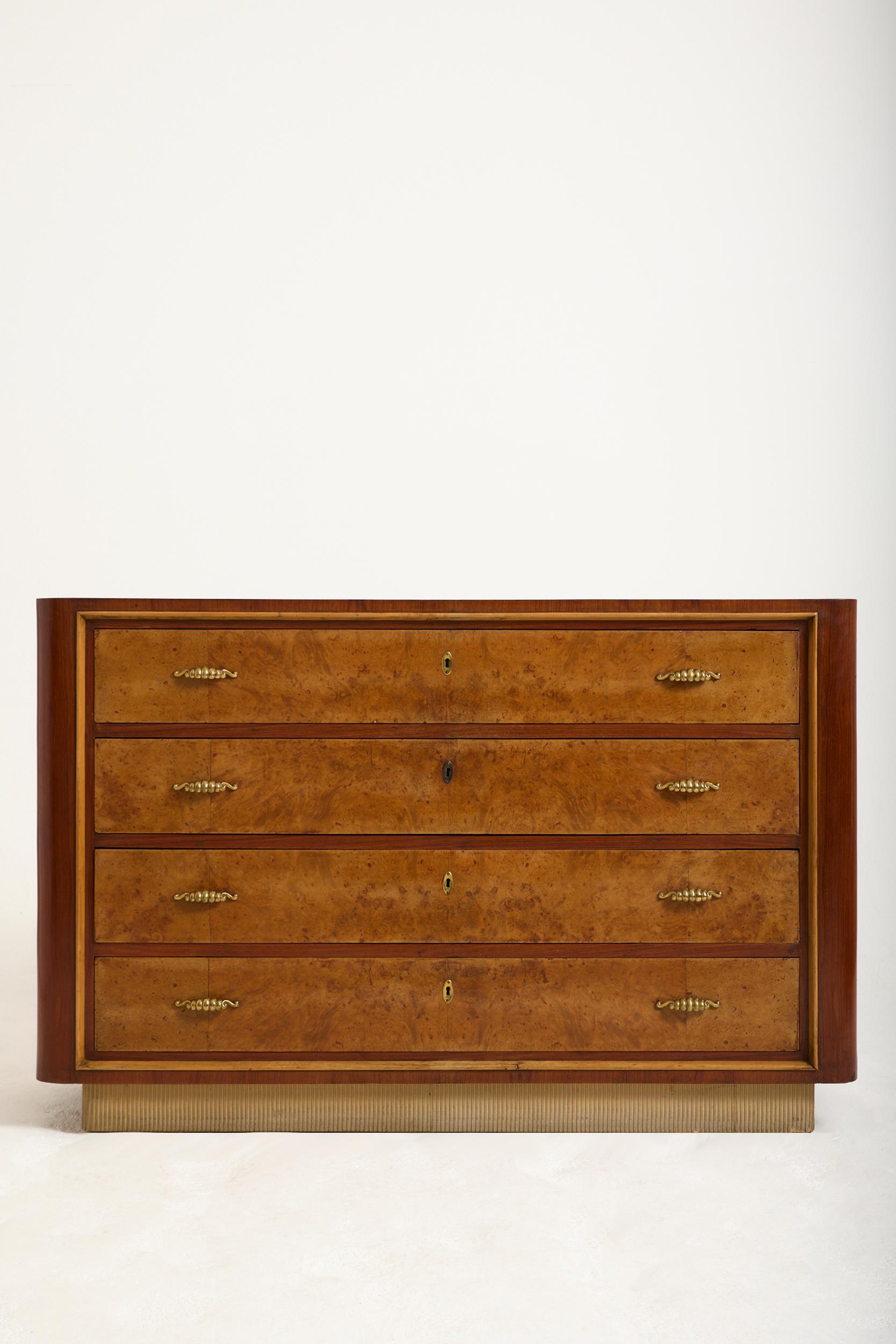 A walnut veneer and burr walnut chest of drawers
Italy, Circa 1940-1950
