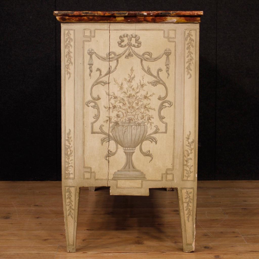Italian style dresser Louis XVI of the 20th century. Furniture of beautiful line and pleasant wooden furniture lacquered and tastefully hand painted neoclassical. Wooden top lacquered fake marble of great quality. Chest of drawers with three front