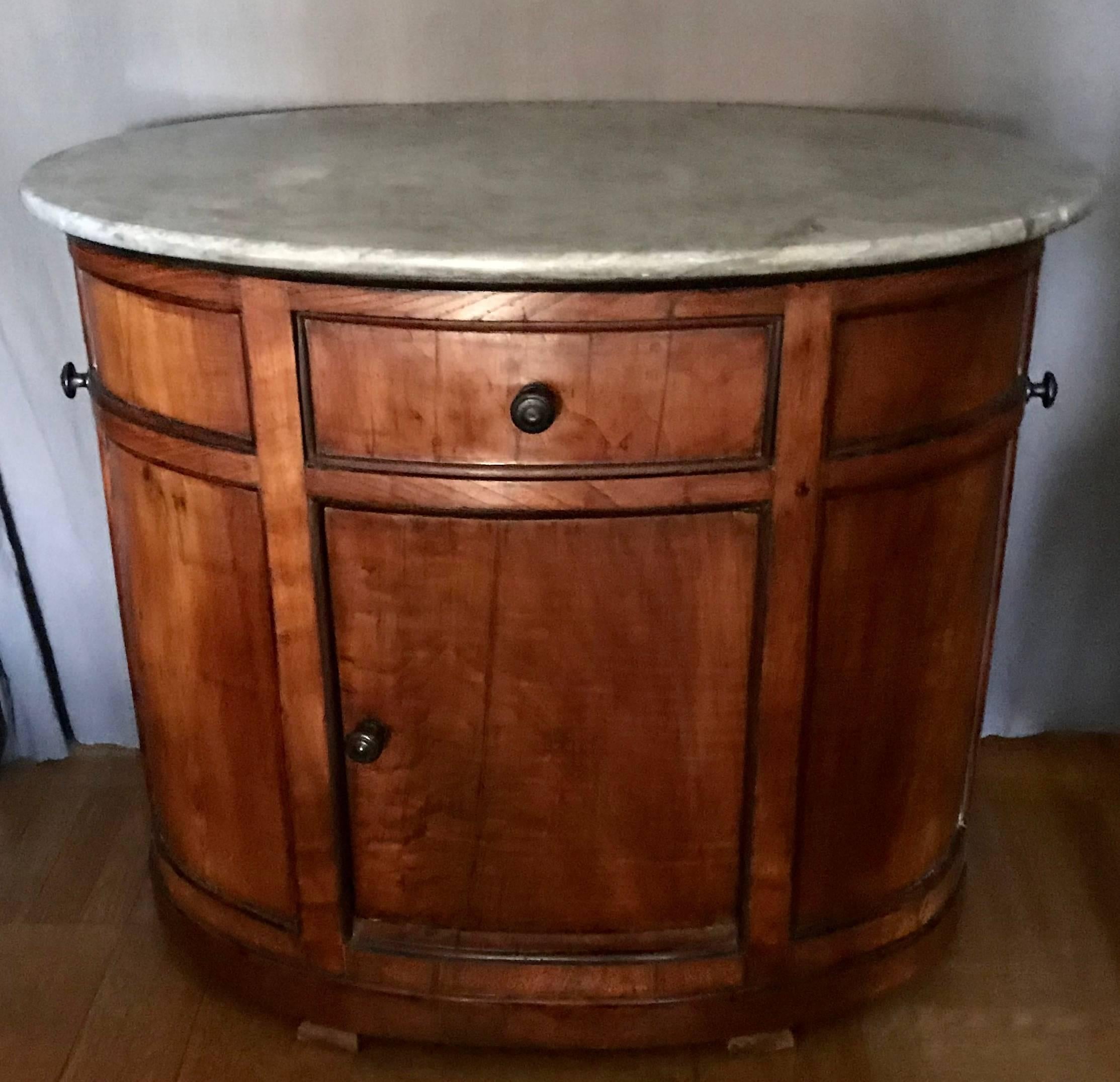 Chestnut oval cabinet with grey marble top with single drawer and door with interior shelves.  Newly restored, perfect in large master-bath, kitchen or dressing room, Italy, circa 1880. 
Dimensions: 38