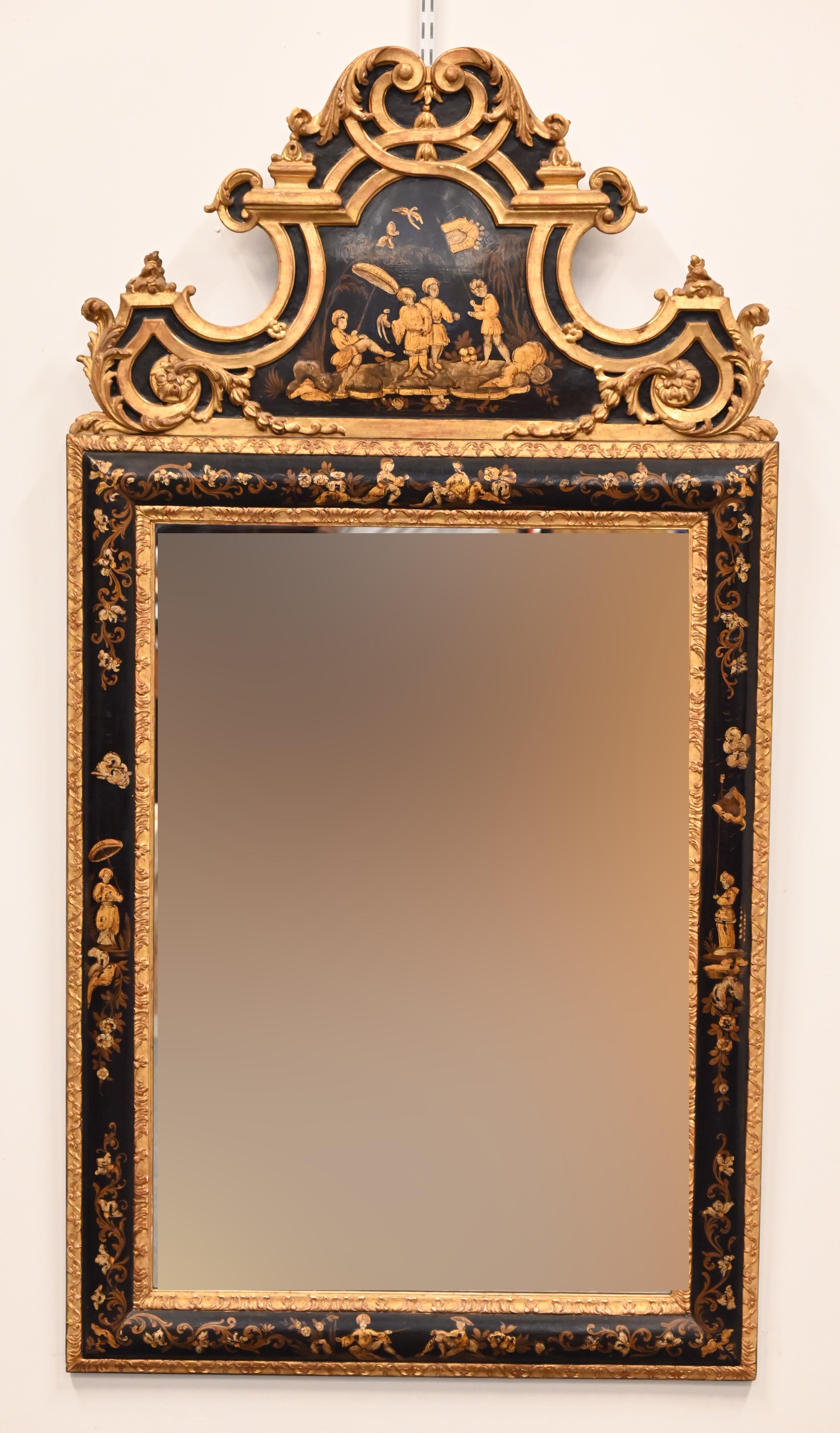 A beautiful and extraordinary chinoiserie mirror made in Europe in the early 20th century. The mirror is most likely Italian or French and was made in the chinoiserie style that was made popular in the 19th Century. This hand-painted mirror has