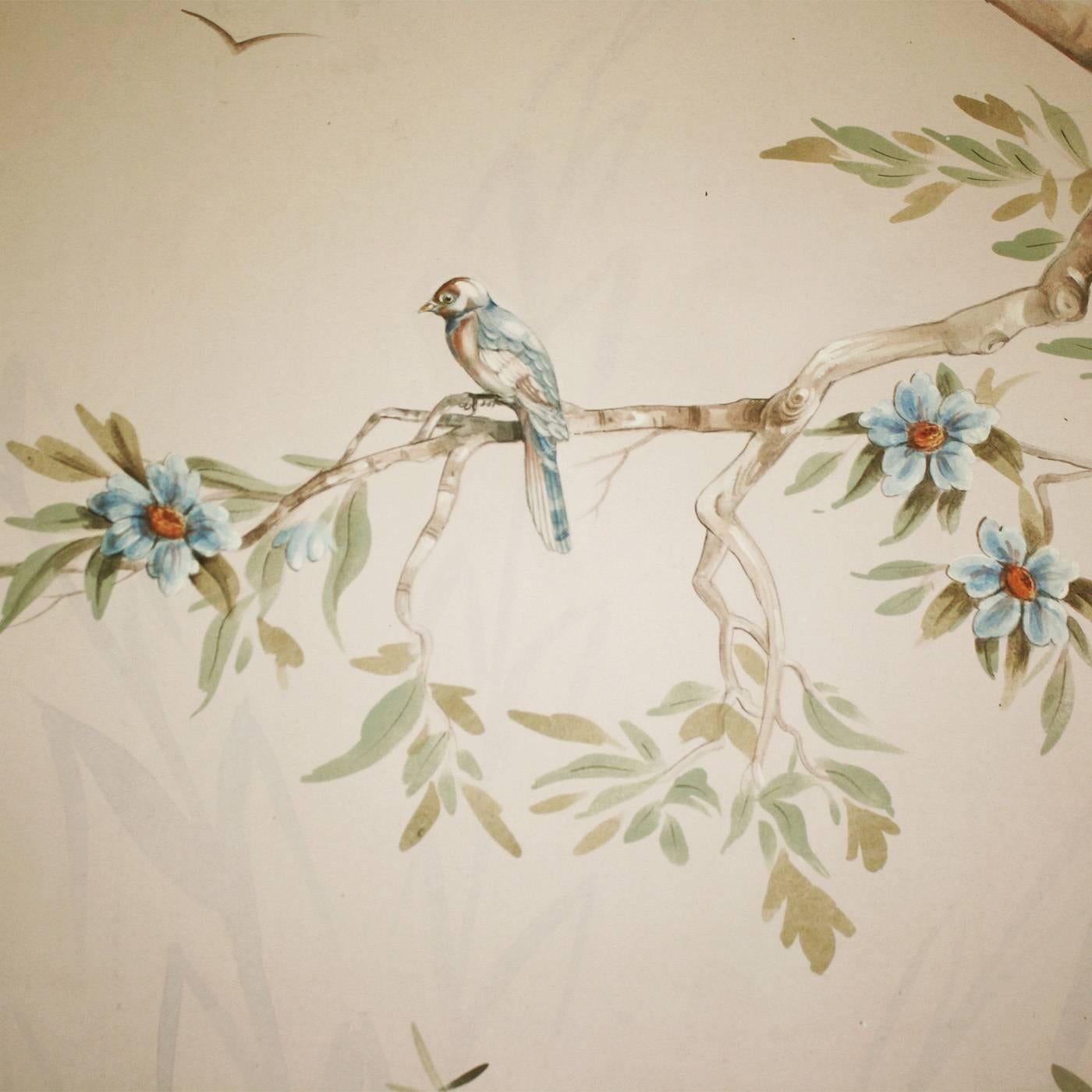 This superb wallpaper was painted by hand on natural cotton canvas and is a one-of-a-kind. The leaves are painted freehand, while the rest of the painting, with its delicate and slender branches and its soft soil accented with stones, is executed