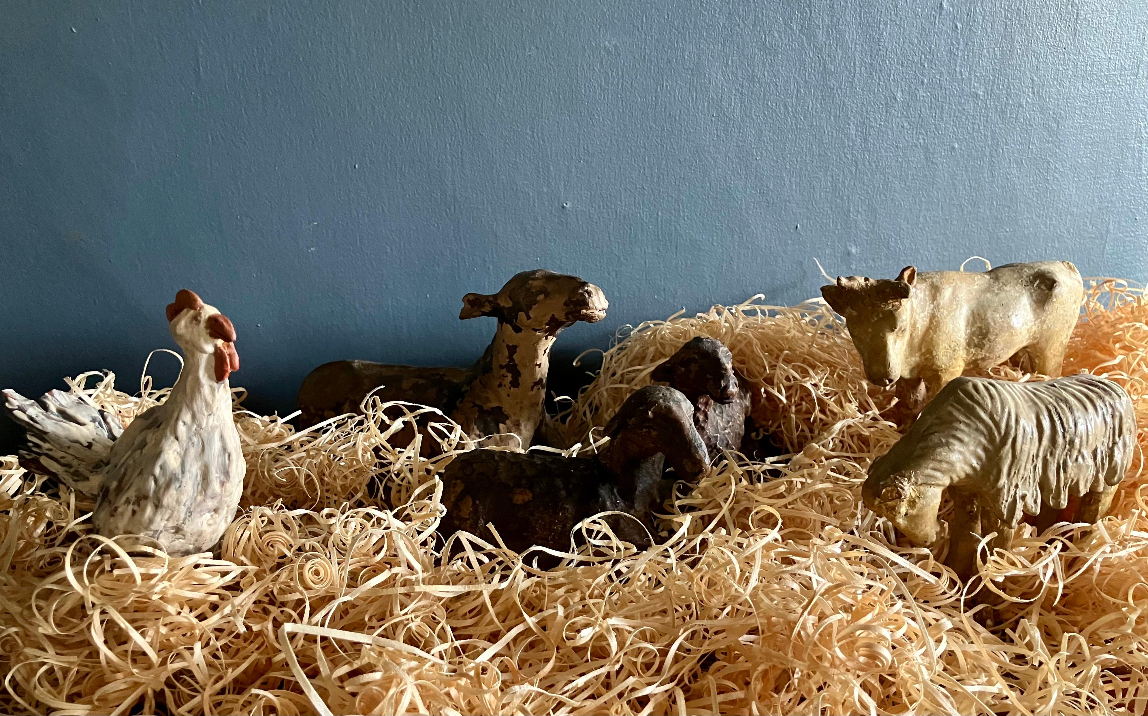 Italian Christmas Manger Animals. Set of six antique hand painted and modeled terracotta 17th century Neapolitan creche animals, in beautiful mottled and worn colors including the donkey, a lowing cow, a pair of resting lambs, a rooster and a