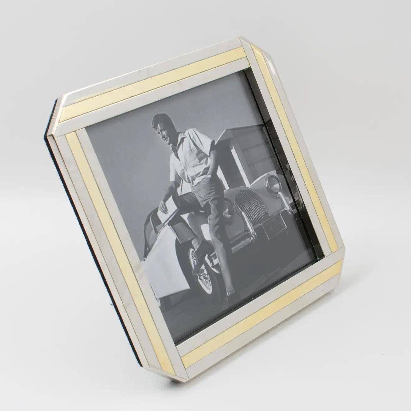 Italian designer A. Elle designed and crafted this stylish 1970s picture photo frame. The gilded brass and chrome geometric design has a Kinetic effect. The easel and back are in black felt, and the frame has a glass protection on the front. The