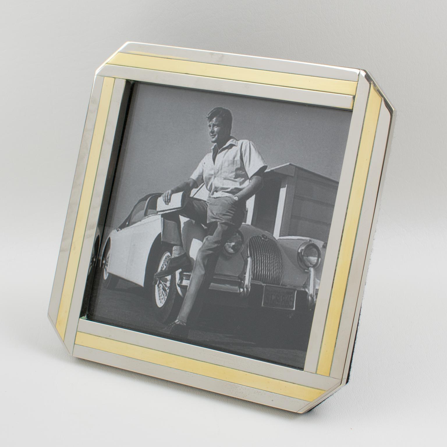 This stylish picture frame from the 1970s was designed and crafted by Italian designer A. Elle. The gilded brass and chrome geometric design has a Kinetic effect. The easel and back are in black felt, and the frame has a glass protection on the