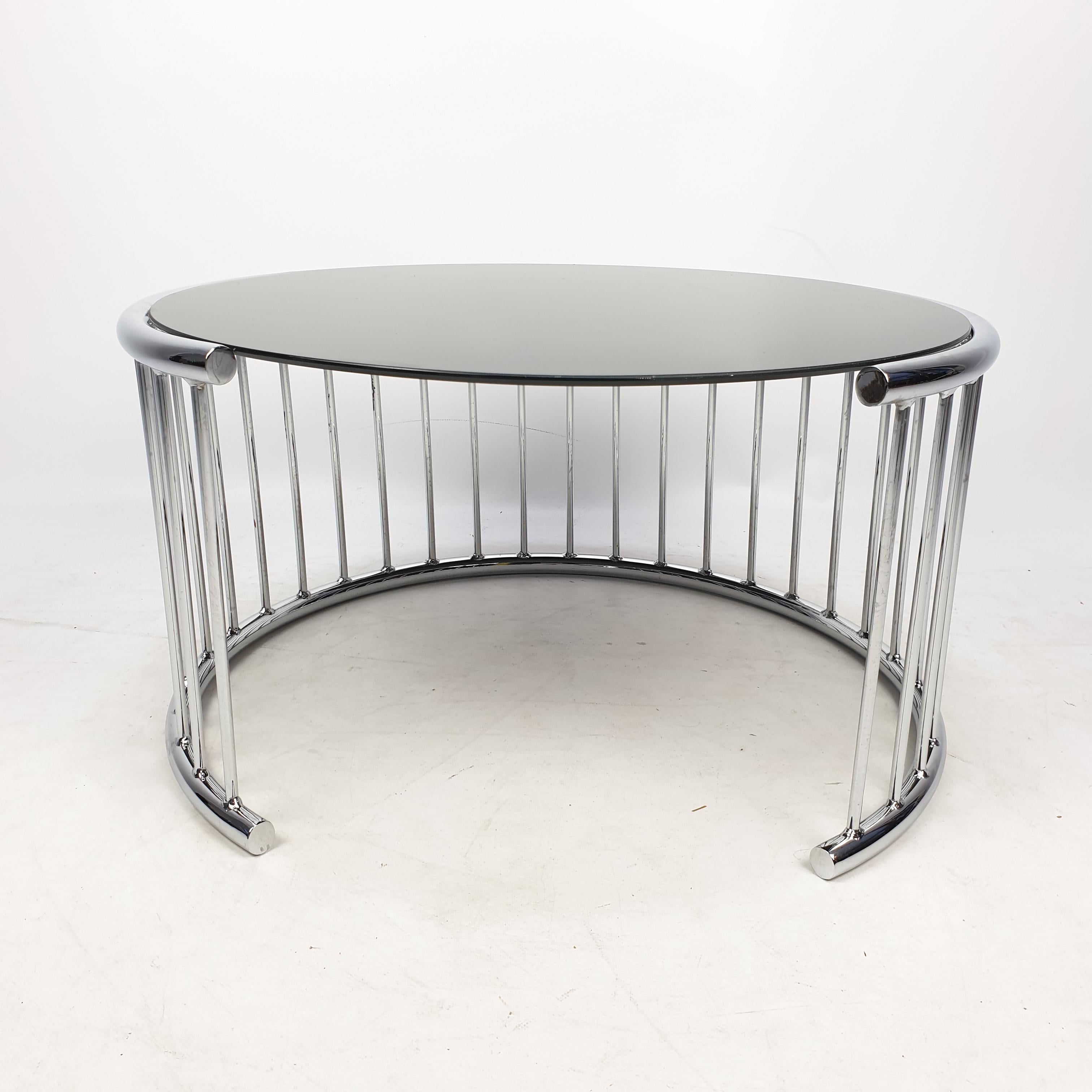 Very nice coffee table, designed in Italy in the 80's. 

Chrome tubes in a open circle with a round glass plate.