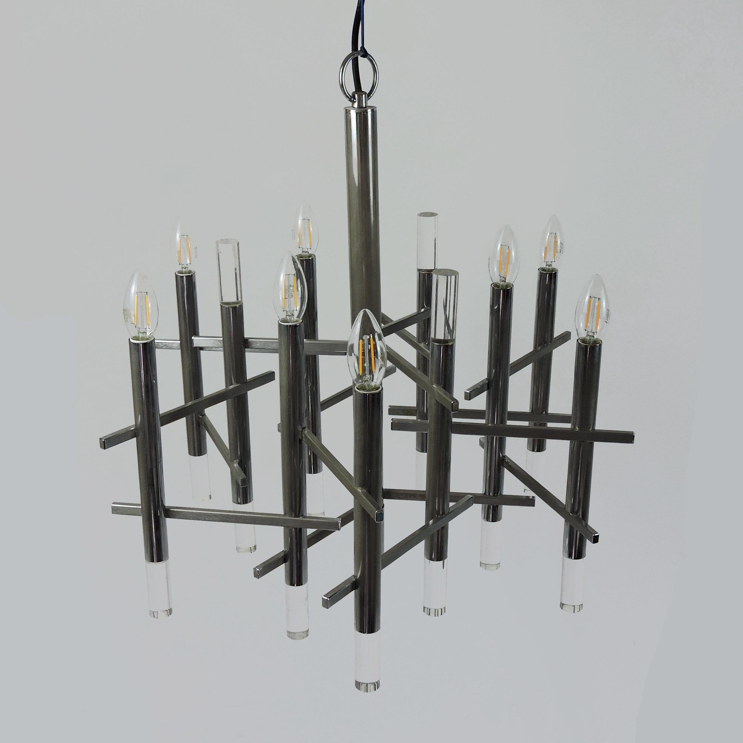 A chandelier designed by Gaetano Sciolari and produced in Italy in 1970. It is made from chromed metal, lucite cylinders.

Designer - Gaetano Sciolari

Manufacturer - Unknown

Design Period - 1970 to 1979

Country of Manufacture -