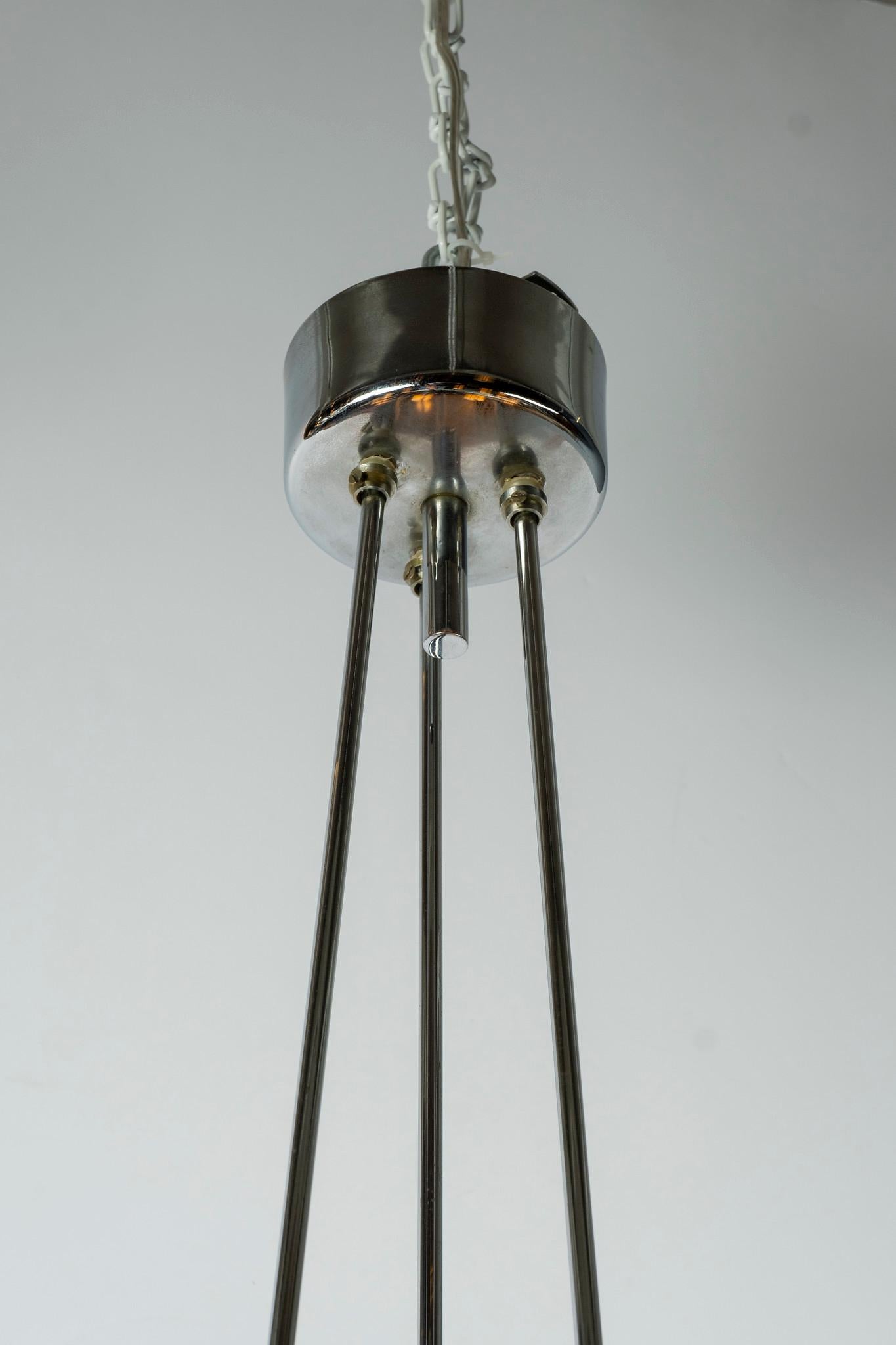 A vintage chrome and smoke glass chandelier from Italy.