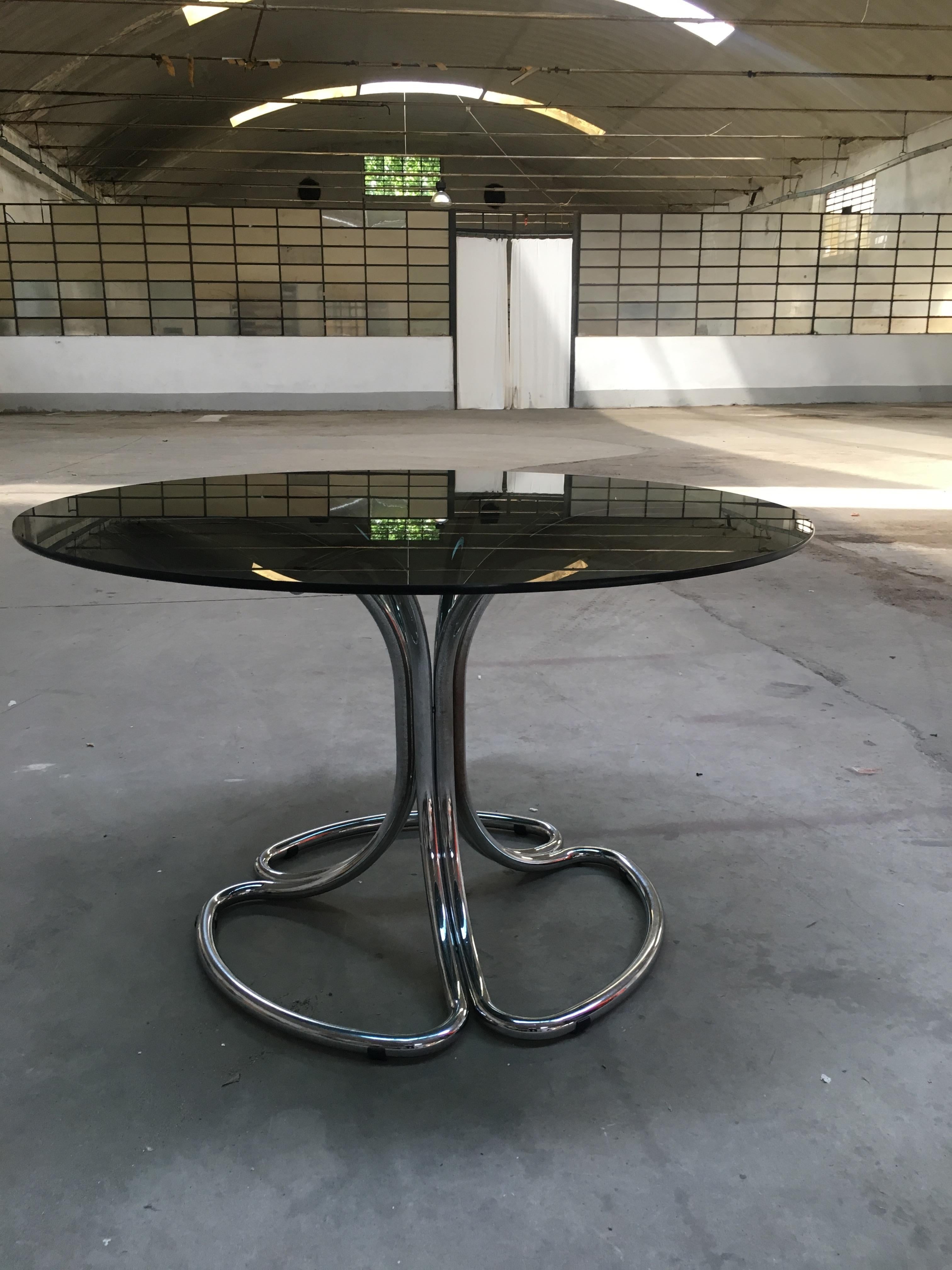 Italian chrome base and smoked glass top dining table by Giotto Stoppino from 1970s
The top of the table has a little sign due to a light scratch as shown in the last picture.