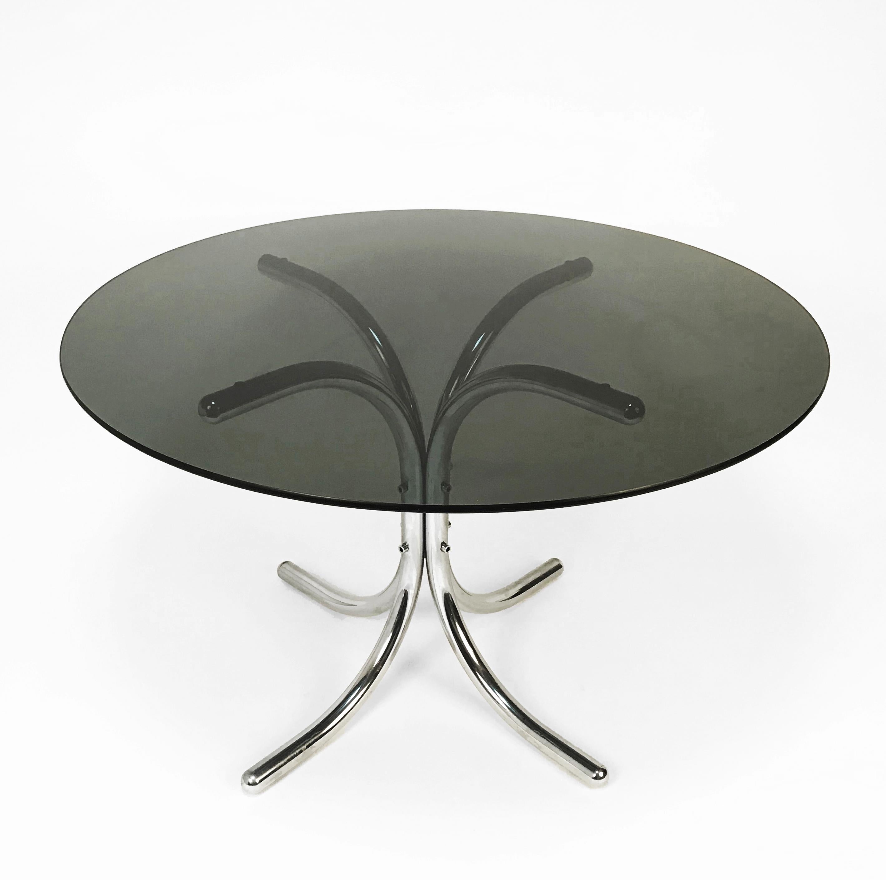 Italian dining table, Giotto Stoppino style. Chromed metal base, smoked glass top. Diameter 120 cm.