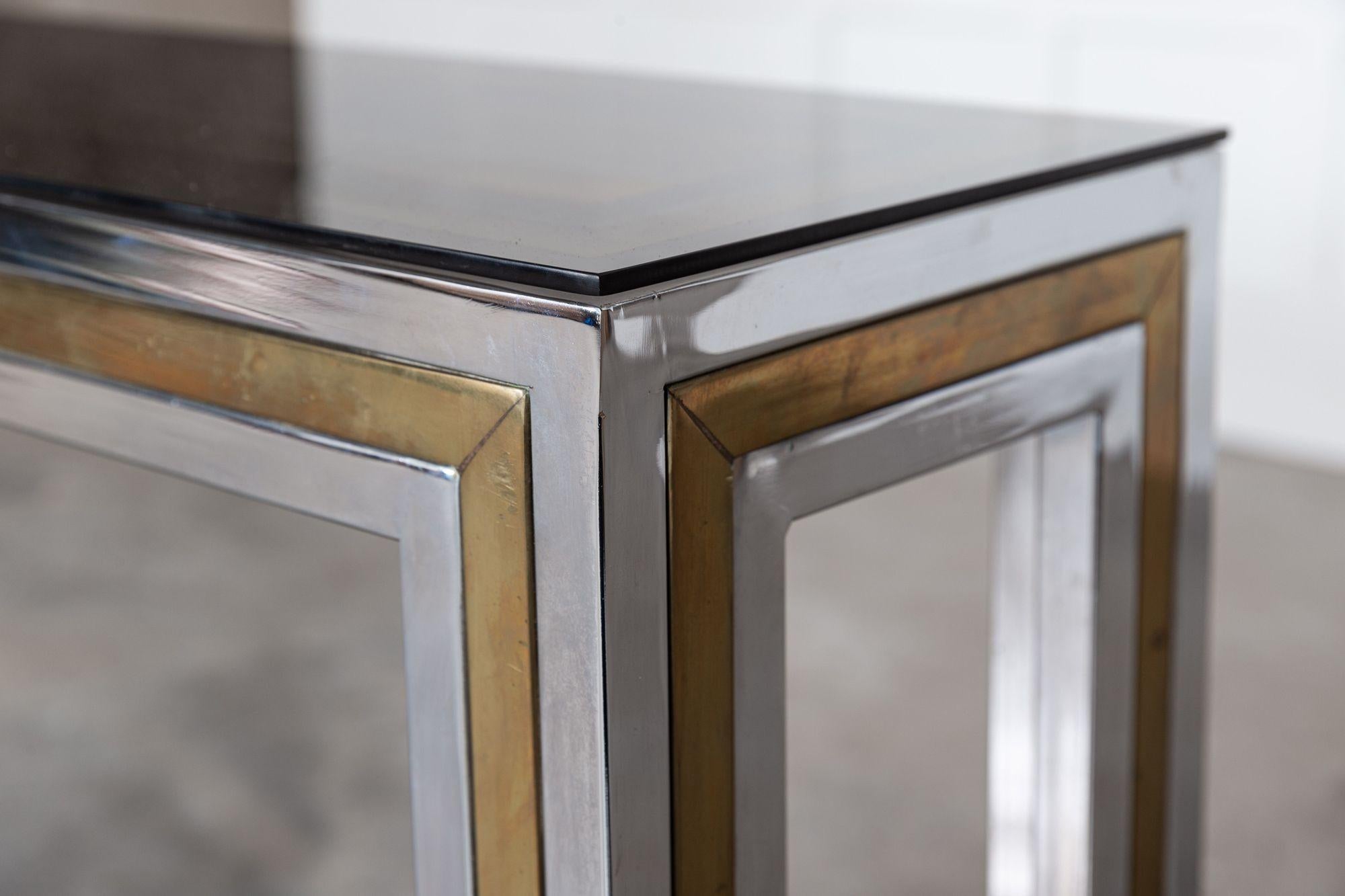 circa 1970
Italian chrome/brass glass console table
sku 1327
Measures: W91 x D30 x H75 cm.