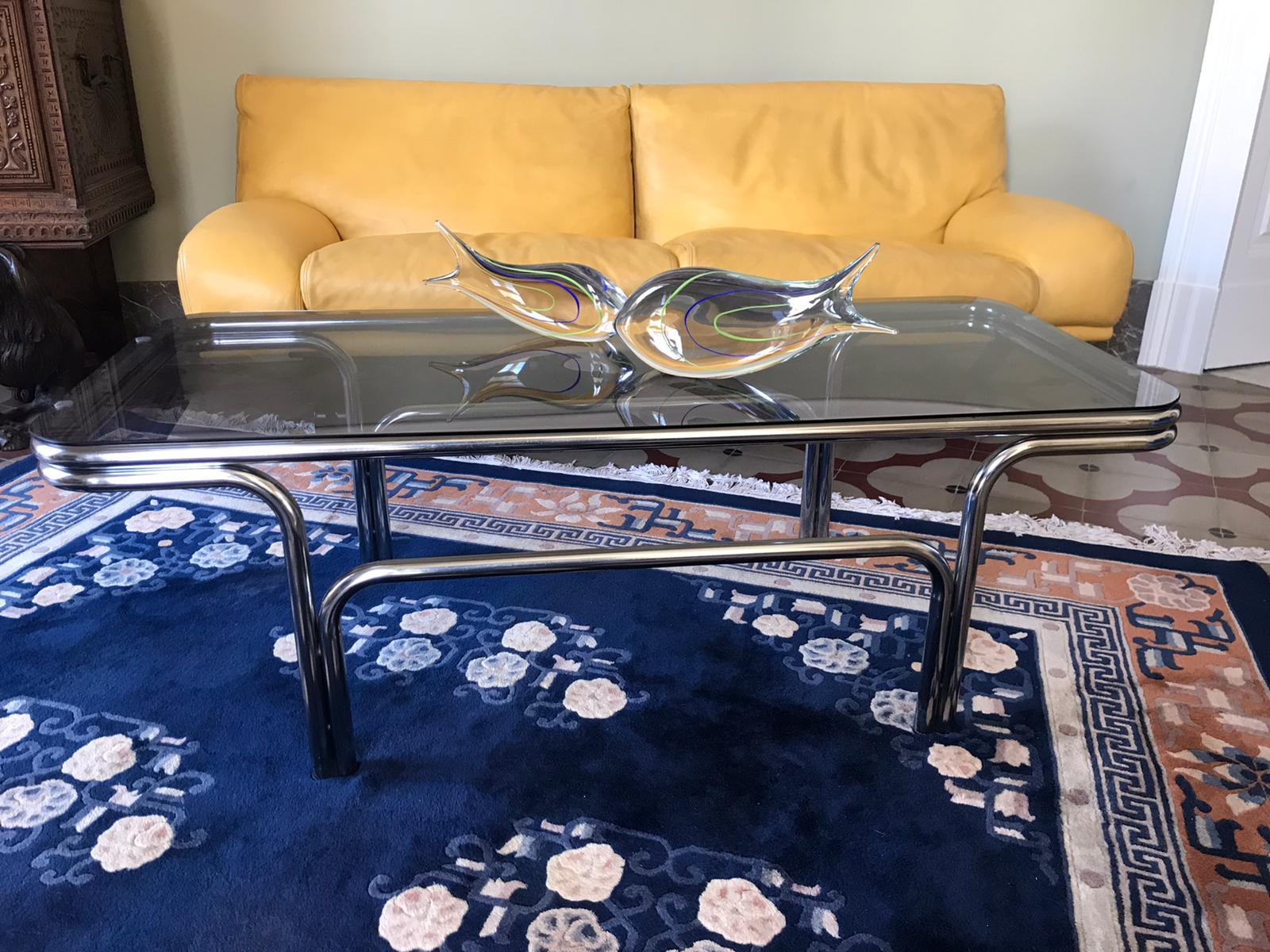 Italian coffee table in chrome with smoked glass top
two available.