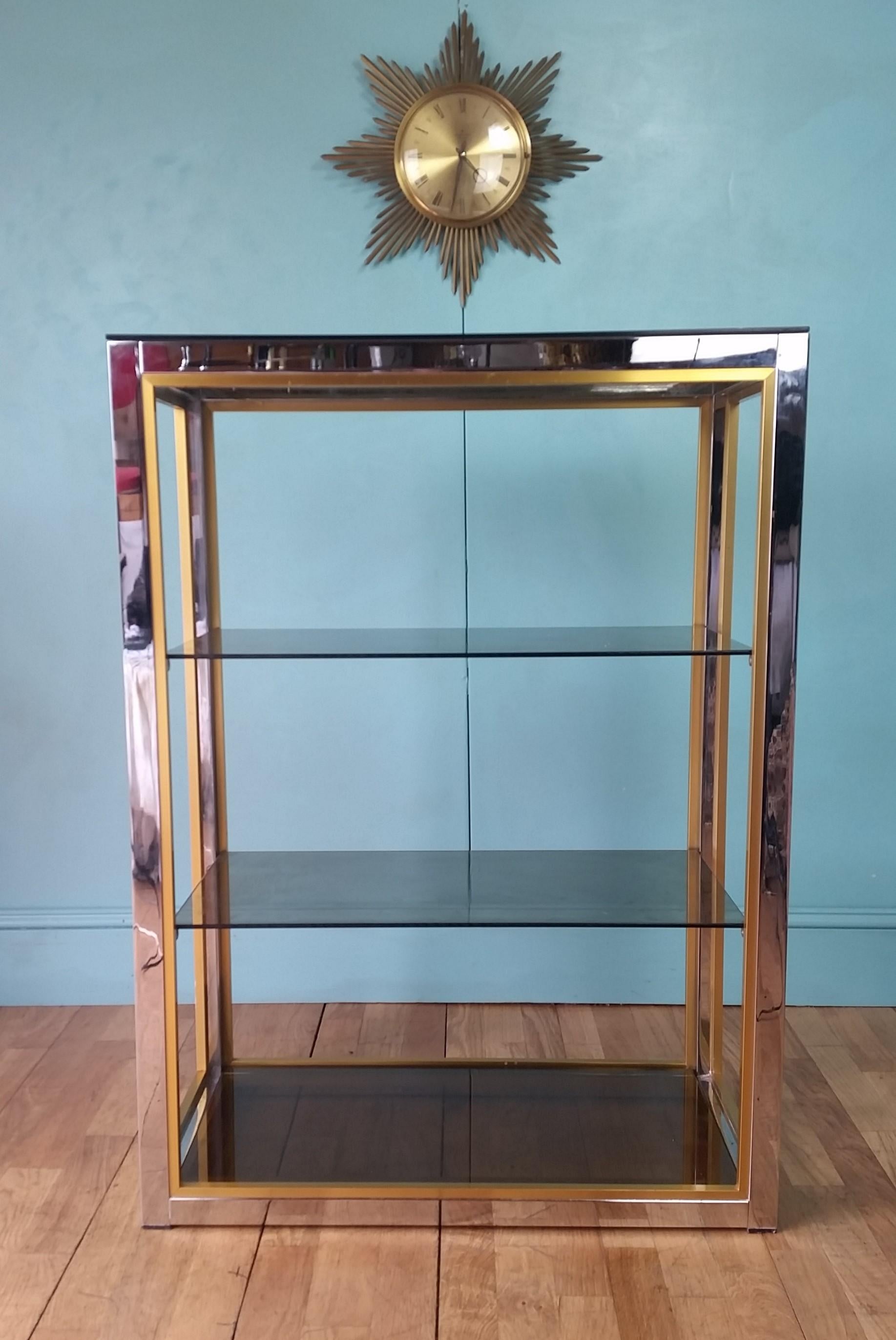 Italian display cabinet designed by Renato Zevi circa 1970's
Polished chrome finish with inner matt gold trim and original tinted glass shelves.
All in lovely vintage condition and full working order with no damage to the glass.
Some wear and