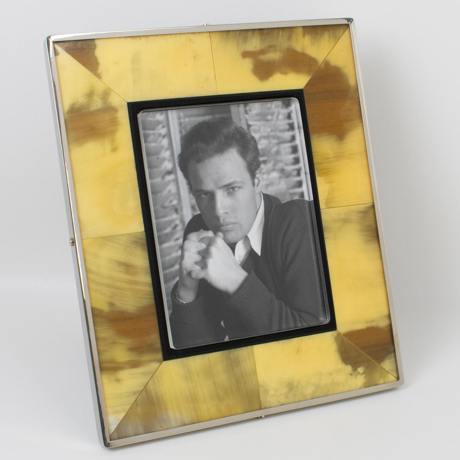 This luxury picture frame was crafted in Italy in the 1970s. The photo frame has an unexpected combination of materials that come together to create a sophisticated design with modernist lines and artistic flair. The framing is in heavy chromed