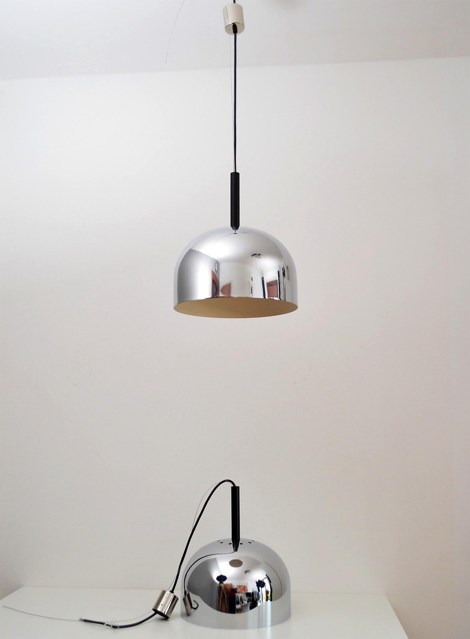 Beautiful set of two pendant lamps with chromed dome shade, inside white.
Made during the 1970s by Stilnovo, Italy.
New wiring, steel cable and chromed canopy.
Sold as set of two.
Light vintage signs of age and wear as shown on the pictures