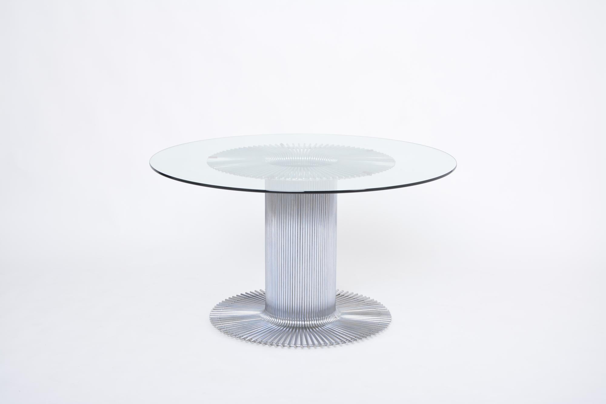 Italian chromed metal and glass dining table in the style of Gastone Rinaldi
Large dining table produced in Italy in the 1970s. The top is made of a circular glass top which measures 1.2 cm in thickness. The glass top has some superficial