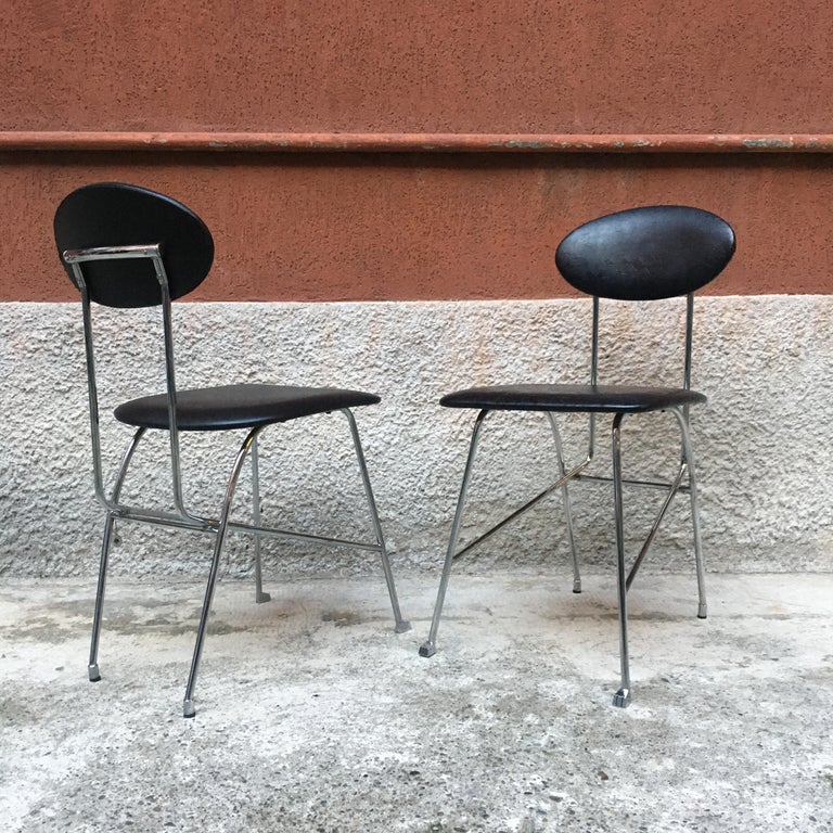 Italian chromed metal chairs with leather cover by Mendini for Zabro, 1980s
Chairs with chromed metal frame, with elegant toe cap and seat and back in black leather, designed by Alessandro Mendini for Zabro.
On one of the two seats there is the