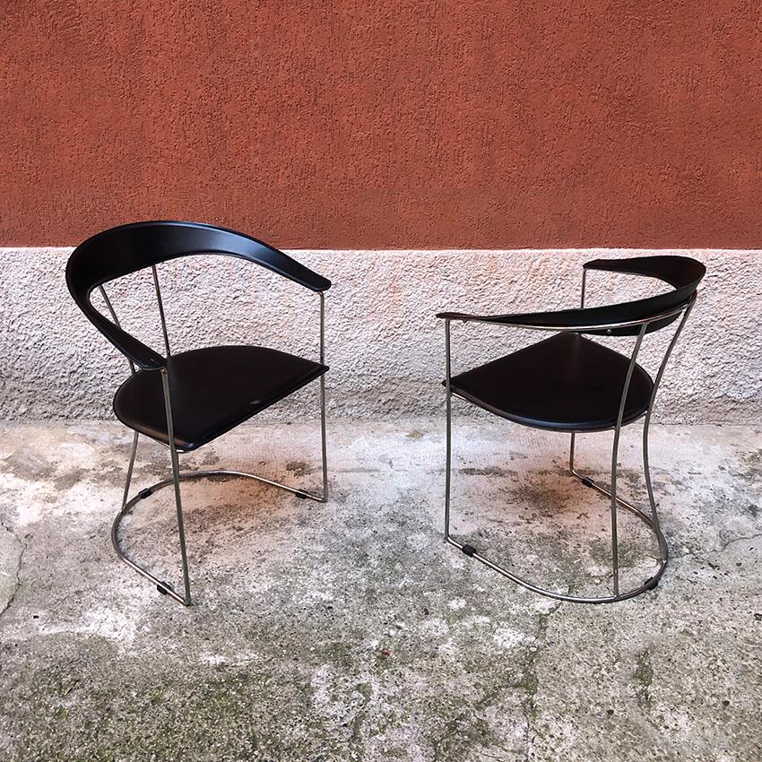 Italian chromed steel, metal and black leather chairs, 1980s. Italian leather chairs, with chromed steel structure and back and seat in curved metal covered in black leather. Coming from the administrative headquarters of a bank in Rome.