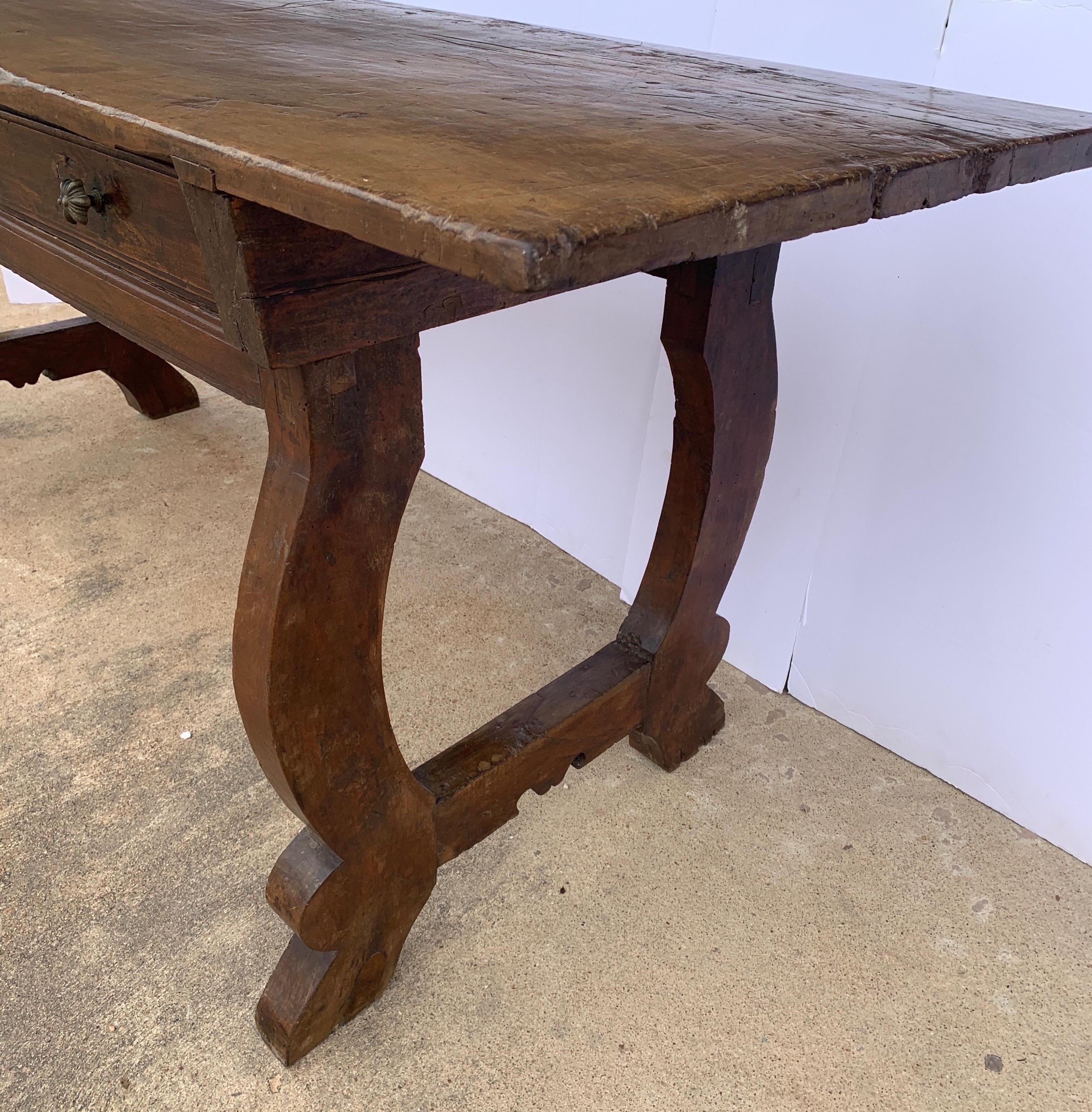 This is a beautiful console or desk from Tuscany made from Walnut. It's go so much character with the dove tail throughout and thick walnut single board top with great patina.