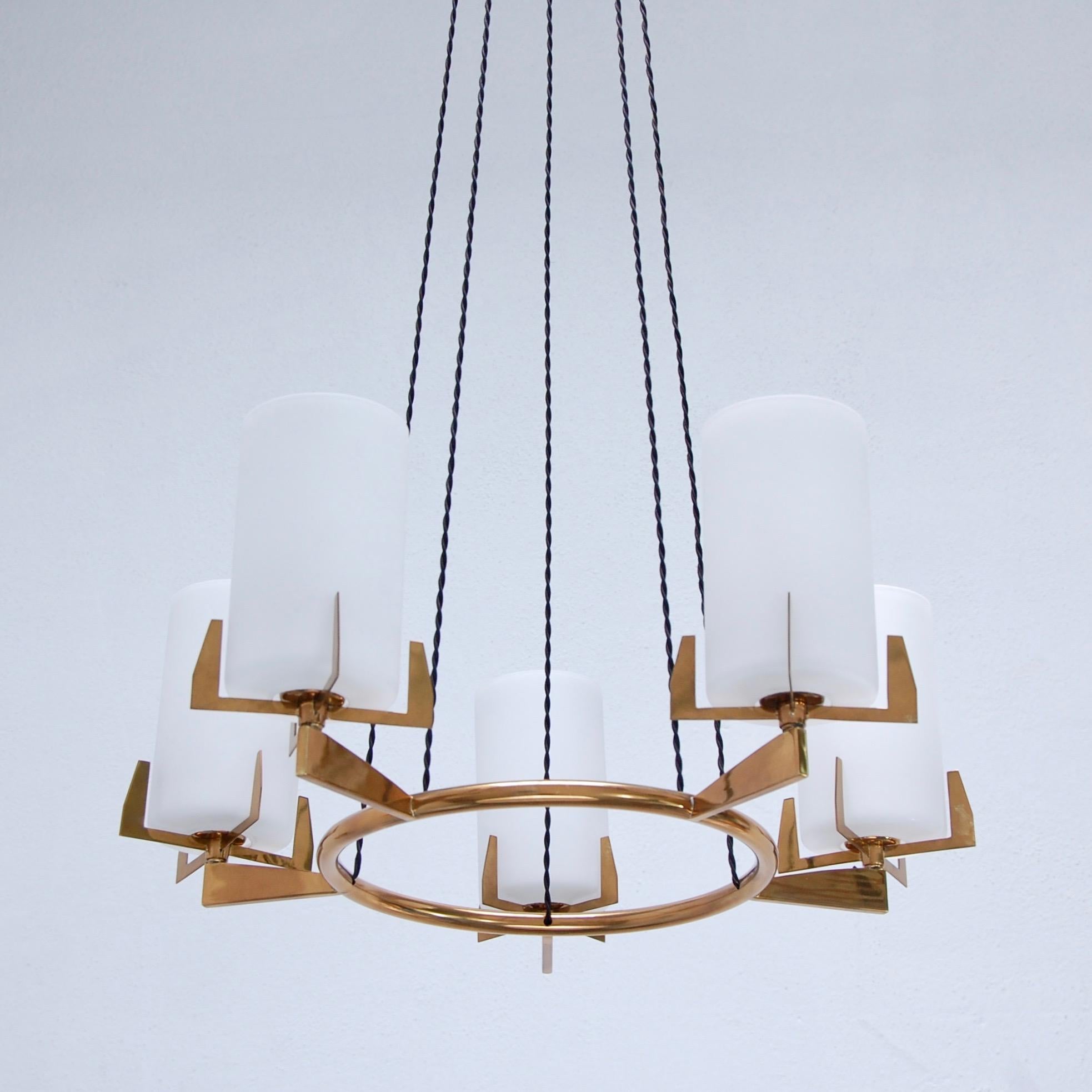 Mid-Century Modern five-light circular chandelier. Five-cylinder glass shades, patinated brass and aluminum details. Fully restored and wired for use in the US. Single E26 medium based light sockets per glass cylinder shade. Light bulbs included