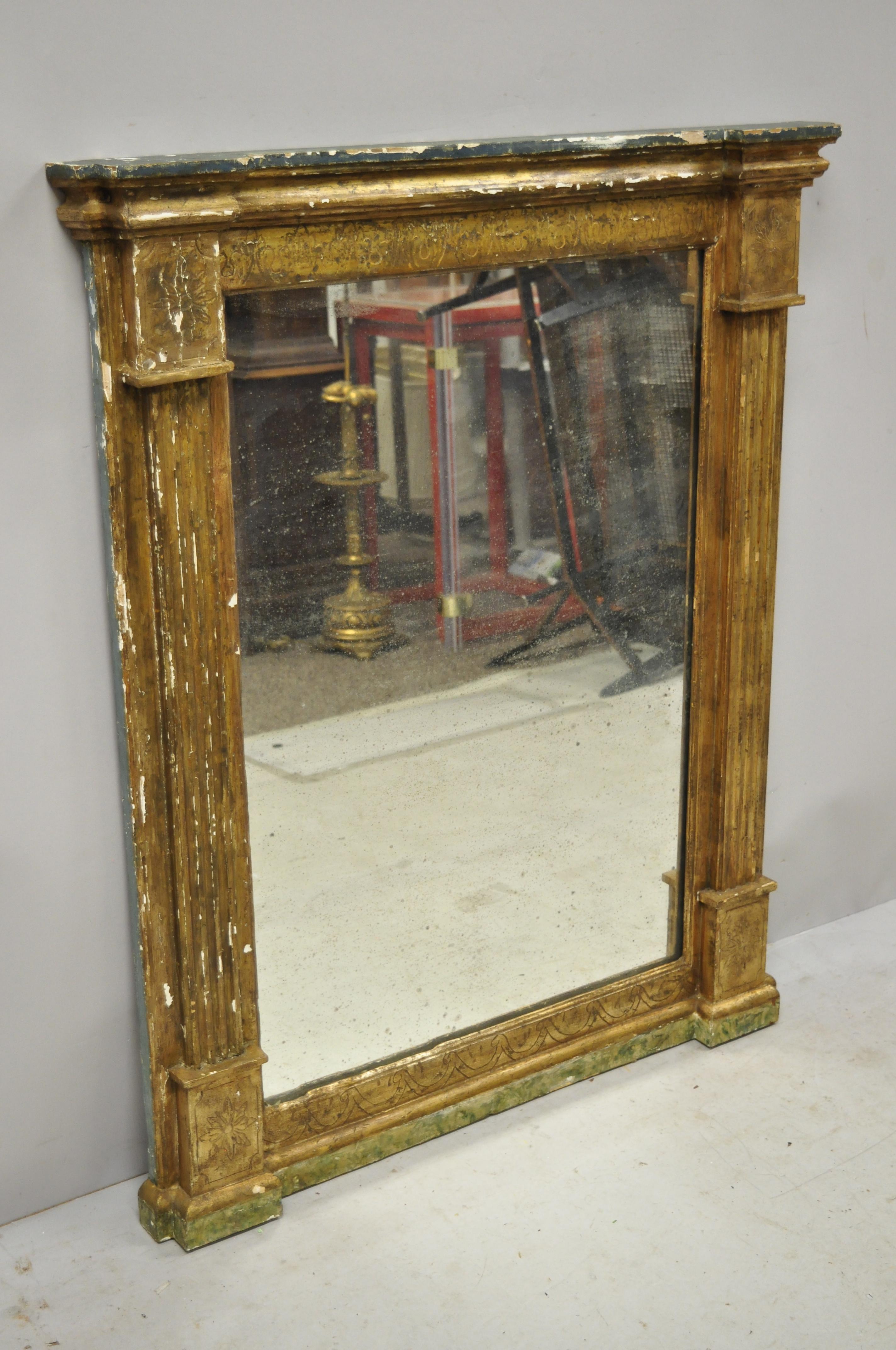 Italian classical Florentine giltwood distressed gold looking glass wall mirror. Item features desirable authentic distressed finish to giltwood frame, aged looking glass mirror, solid wood frame, nicely carved details, very nice antique item,