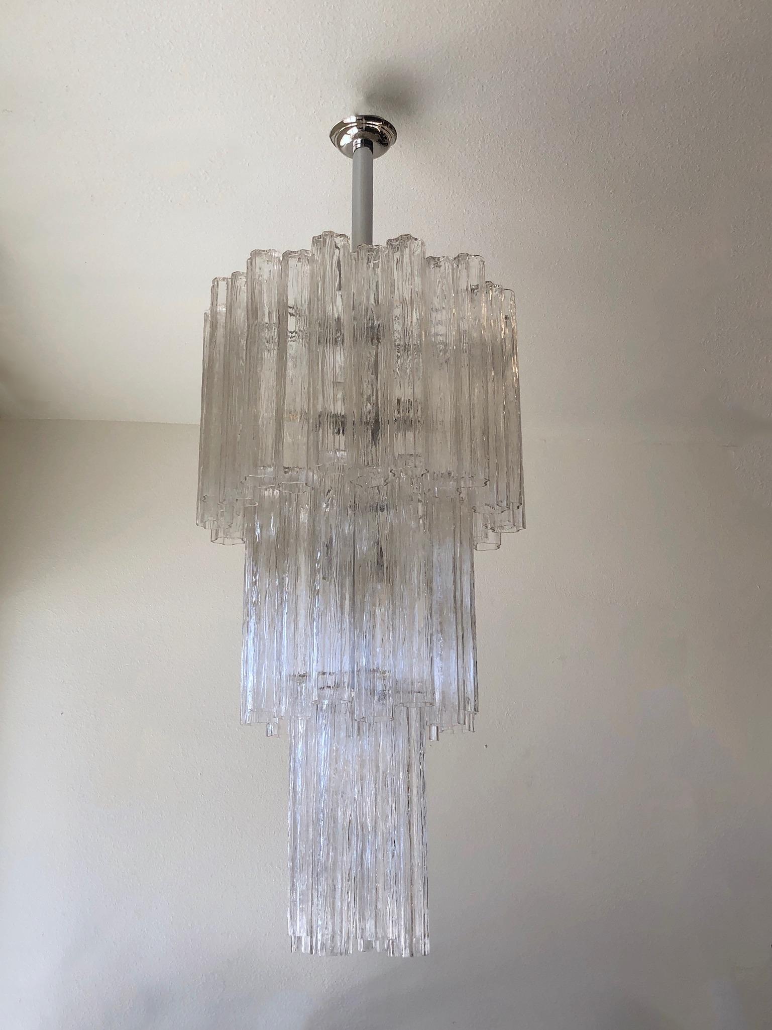 Large 1970s Italian clear Murano glass and polish chrome ’Tronchi’ chandelier by Venini. 
The skeleton shows minor wear consistent with age.
It takes 13 regular Edison lightbulb.
Measurements: 25” diameter and 65” high to ceiling cap.
Note: We