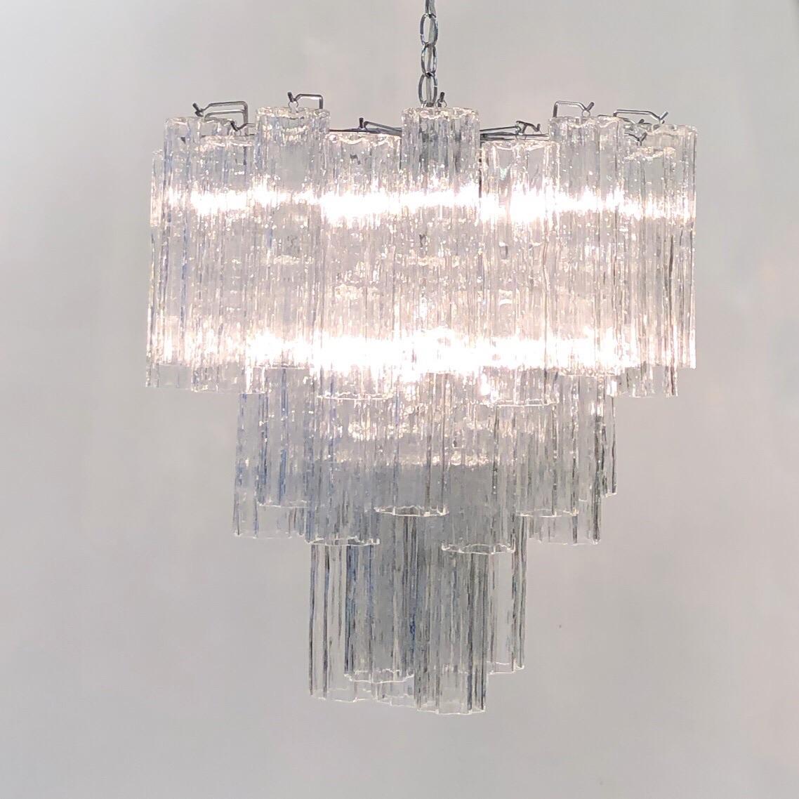 A glamorous Italian chrome and clear Murano “Tronchi” chandelier design by Venini in the 1970s. Newly rewired. Dimensions are for just the chandelier, not the chain. Let us know the length of chain that you need. 

Dimensions: 24” high, 23”