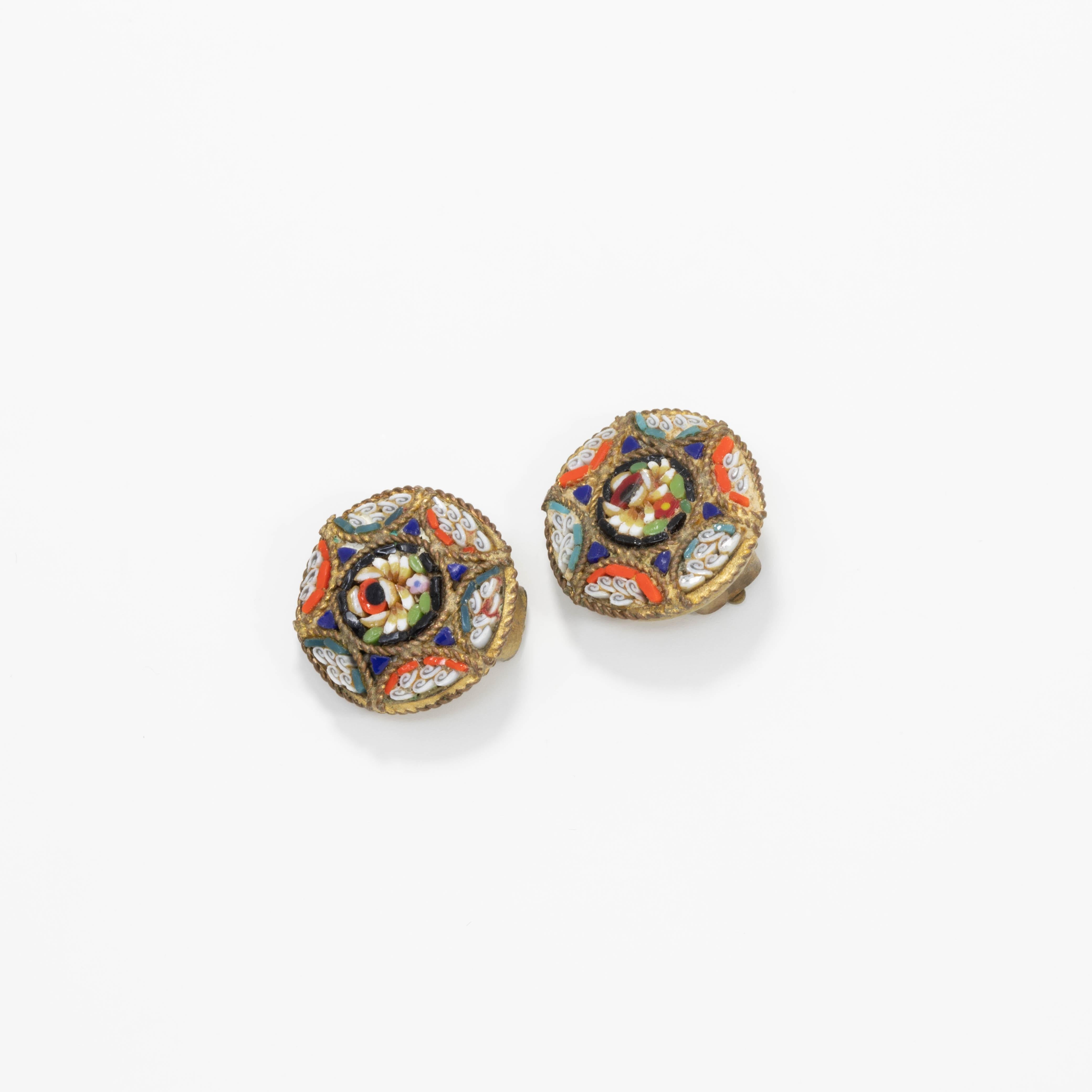 A pair of small but stylish Italian cloisonne button clip on earrings with blue, orange, white, and green floral motifs. Brass-tone setting.

Tags, Marks, Hallmarks: Italy (one earring)
